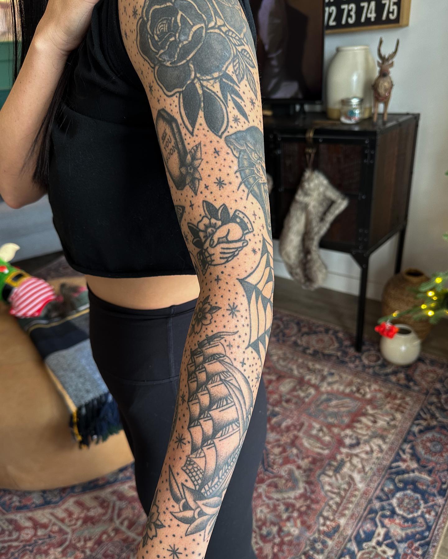 Ship and floral dotwork tattoo on the forearm by Gabby Tolley🌛