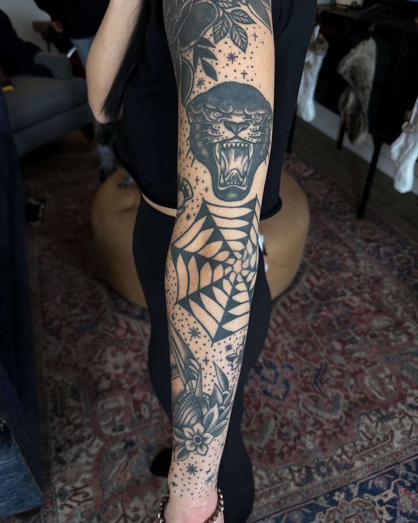 Panther and geometric patterns American traditional tattoo on the forearm by Gabby Tolley🌛