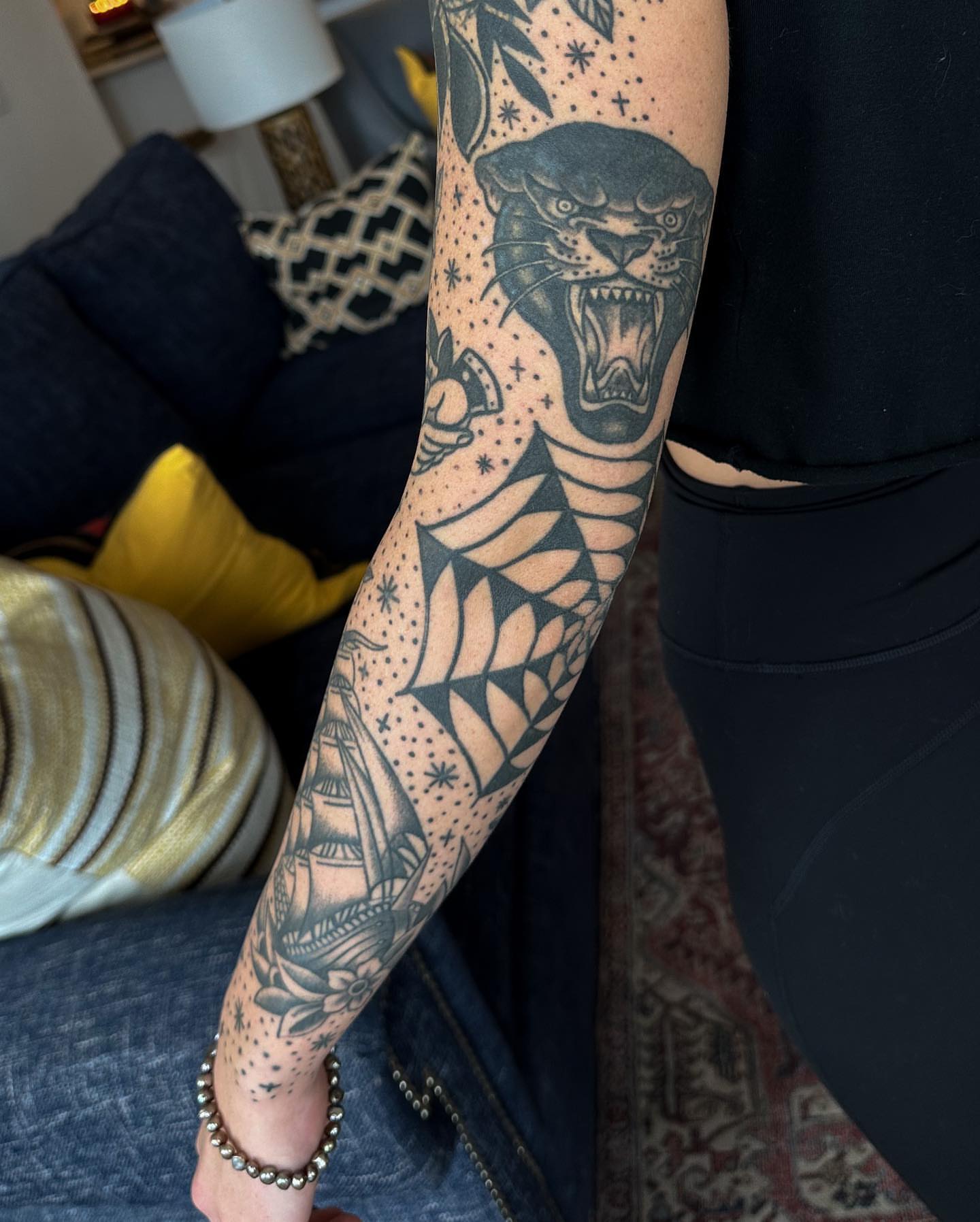 Panther and ship dotwork tattoo on the forearm by Gabby Tolley🌛