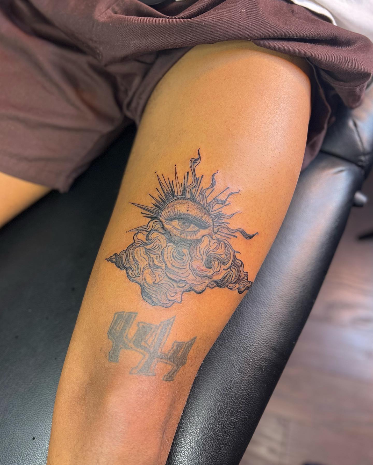 Eye and cloud black and grey tattoo on the thigh by ✨BADJASS the tattoo artist✨