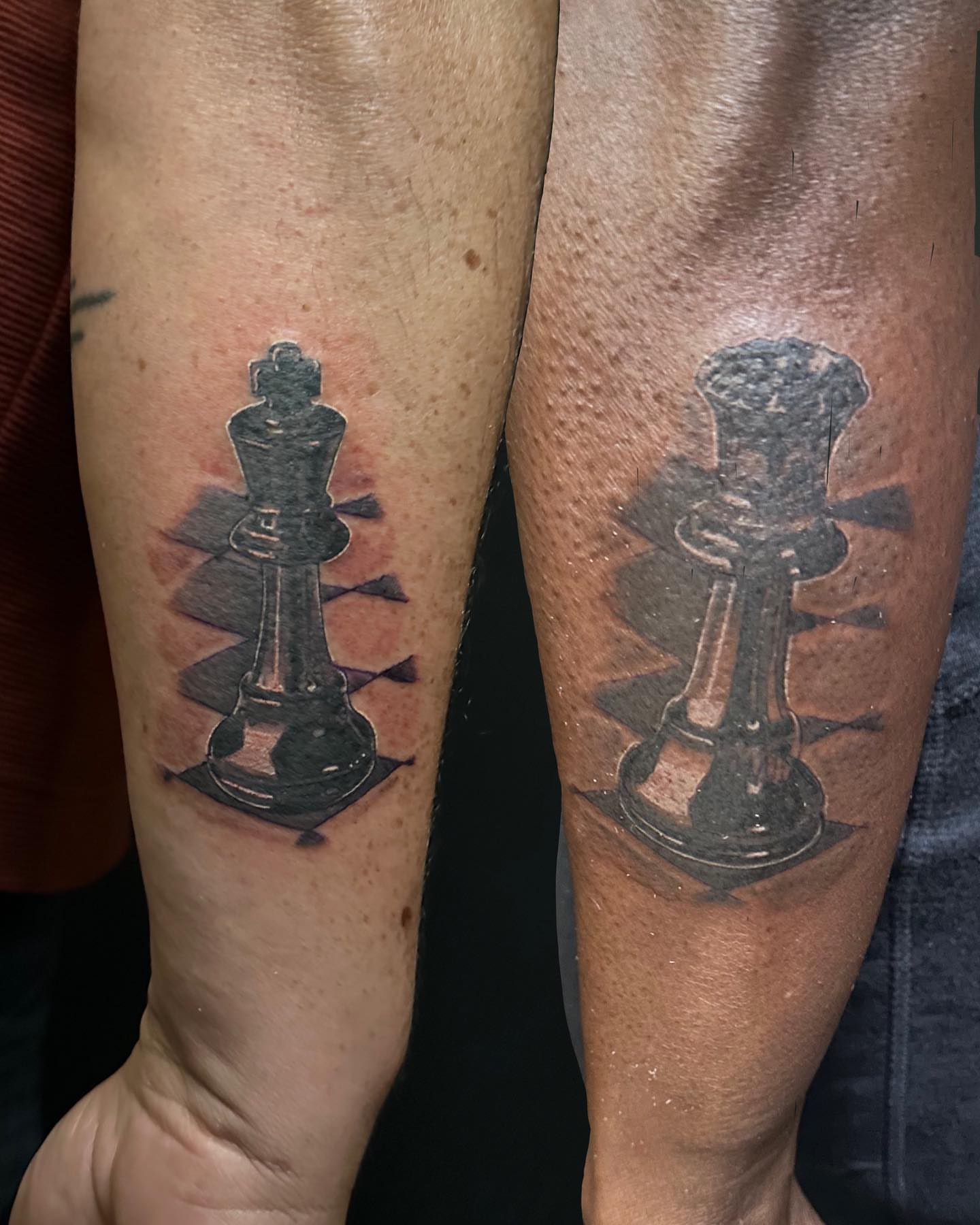Chess pieces black and grey tattoo on the forearm by las vegas tattoo artist