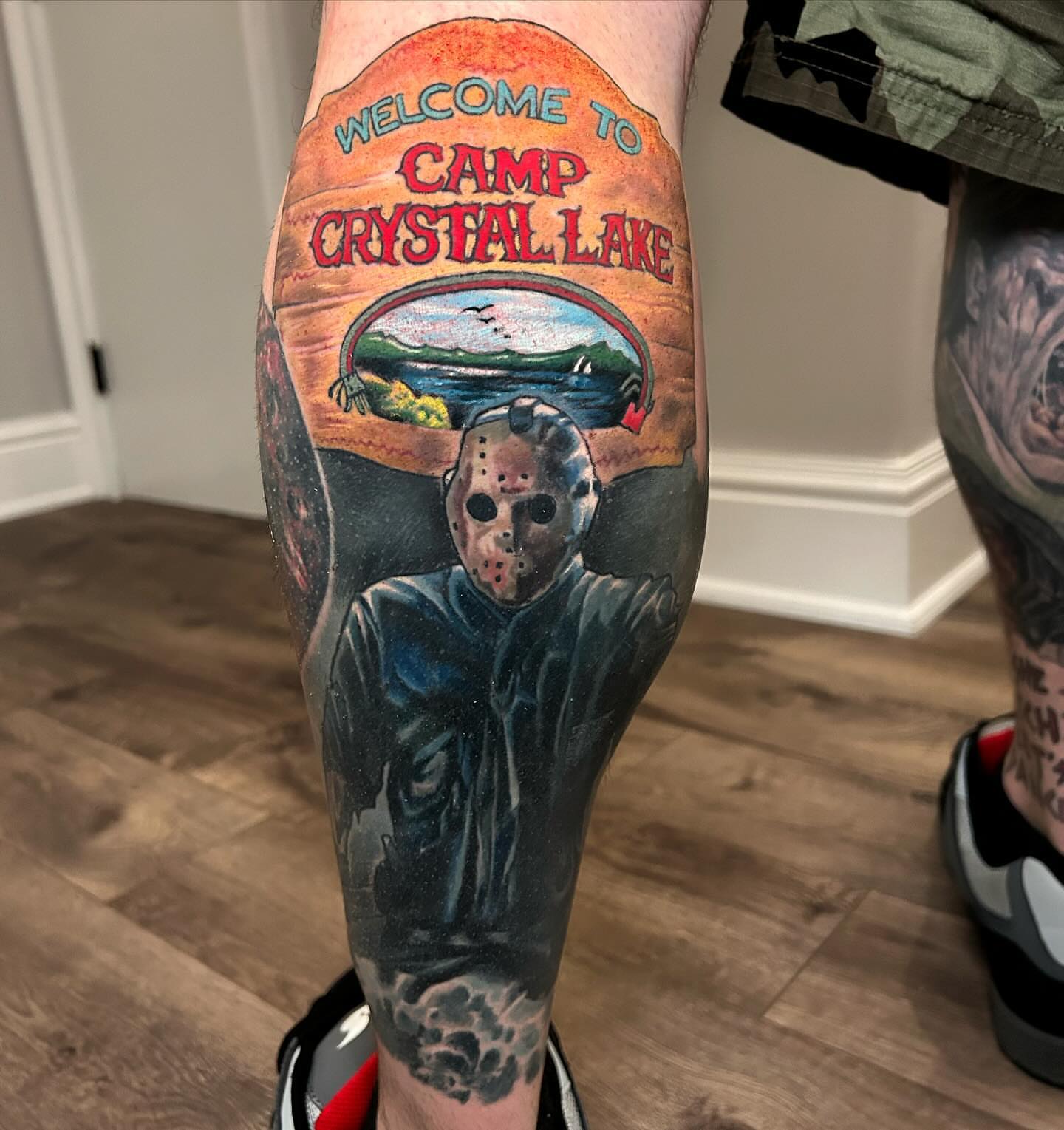 Camp Crystal Lake realism tattoo on the calf by Marvin Silva