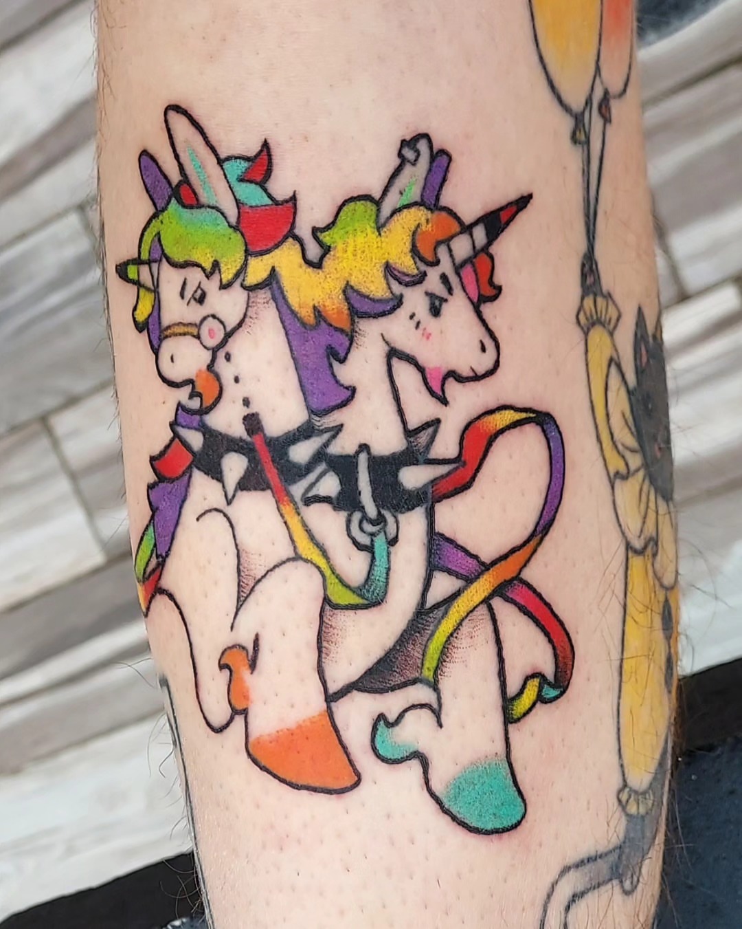 Unicorns new school tattoo on the forearm by Spike Cameron