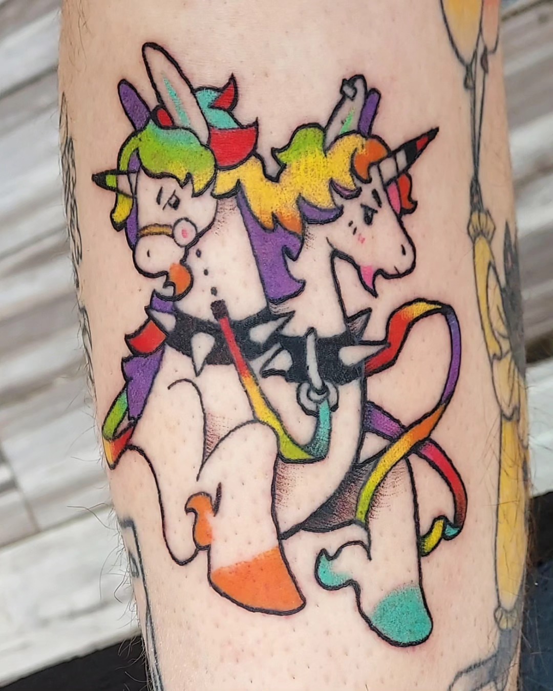 Unicorns new school tattoo on the forearm by Spike Cameron