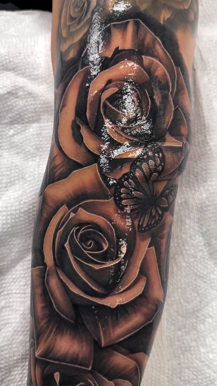 Roses and a portrait realism tattoo by Joshua ramirez, Montebello, California