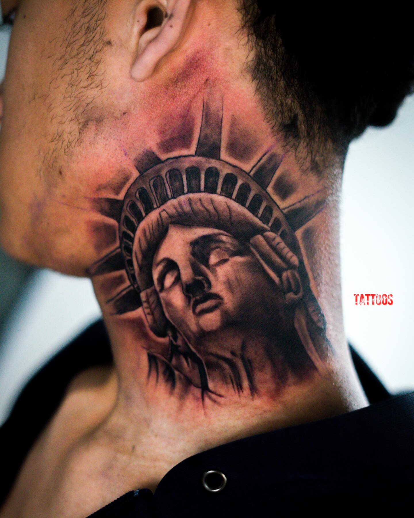Statue of liberty realism tattoo on the neck by Josh Acosta