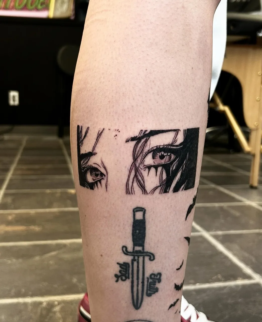 Eyes and dagger realism tattoo on the forearm by Dylan Stevens