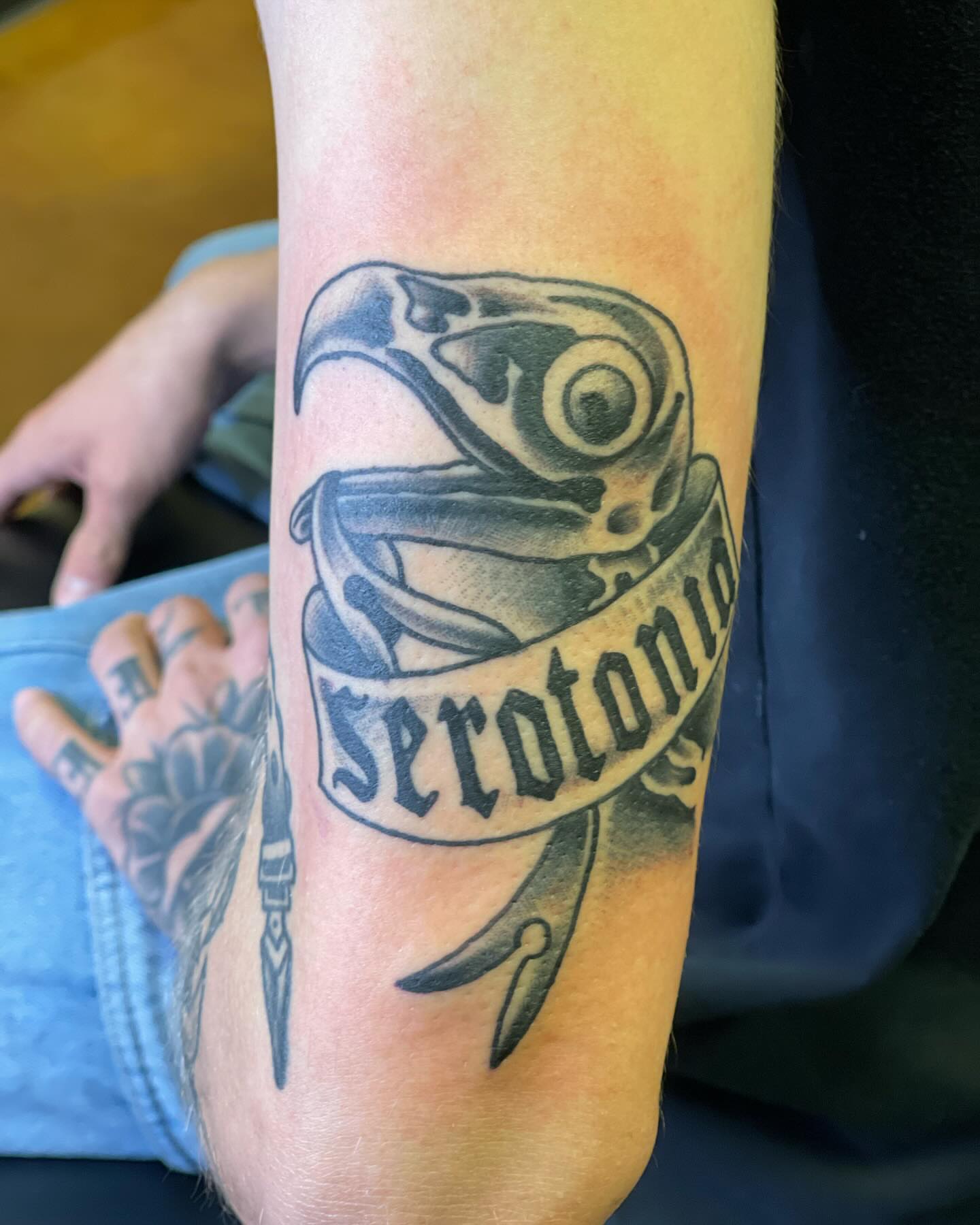 Raven with banner black and grey tattoo on the forearm by 💀good To the Grave💀