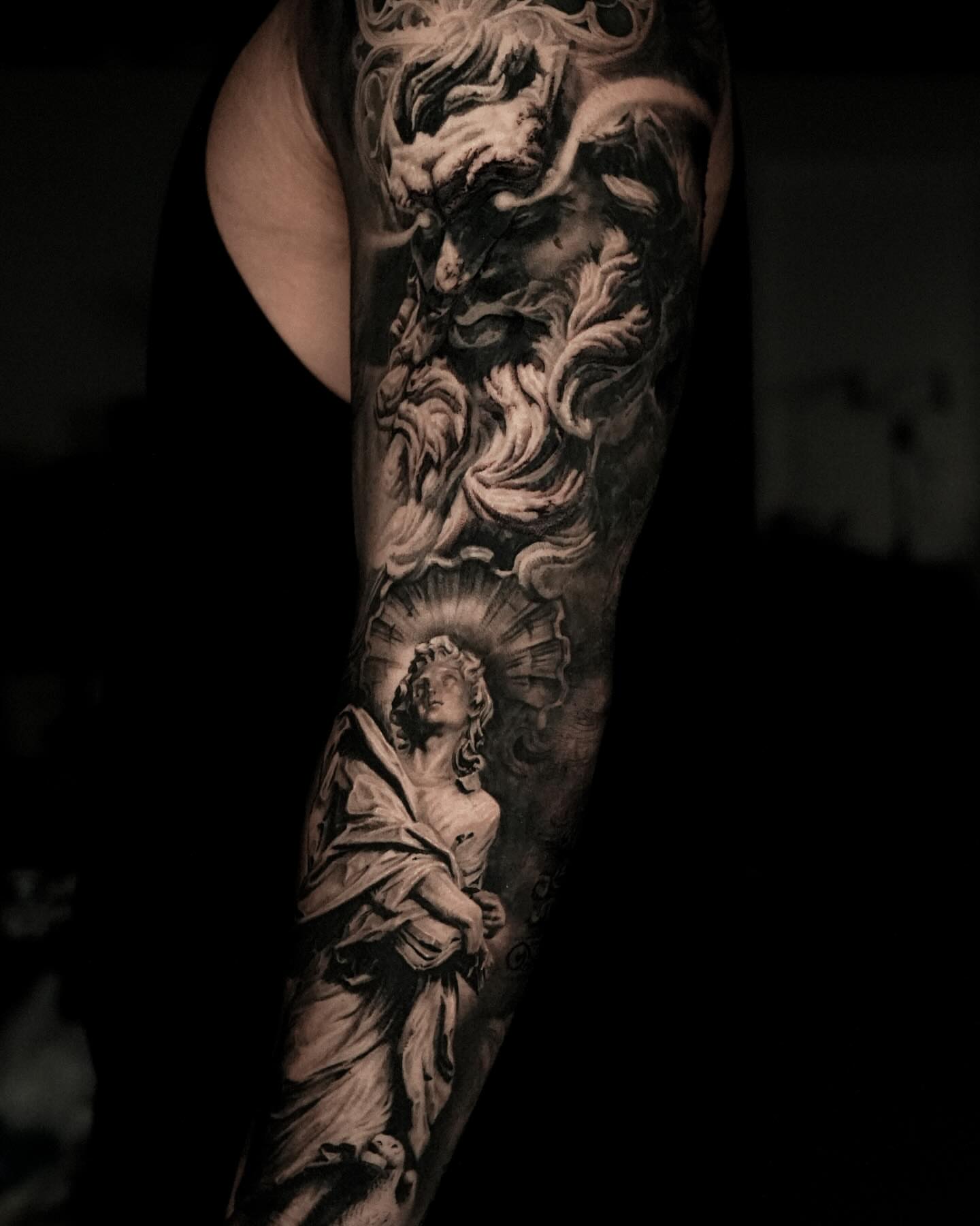 Religious statue realism tattoo on the forearm by Black and Grey Tattoo Artist Umzii