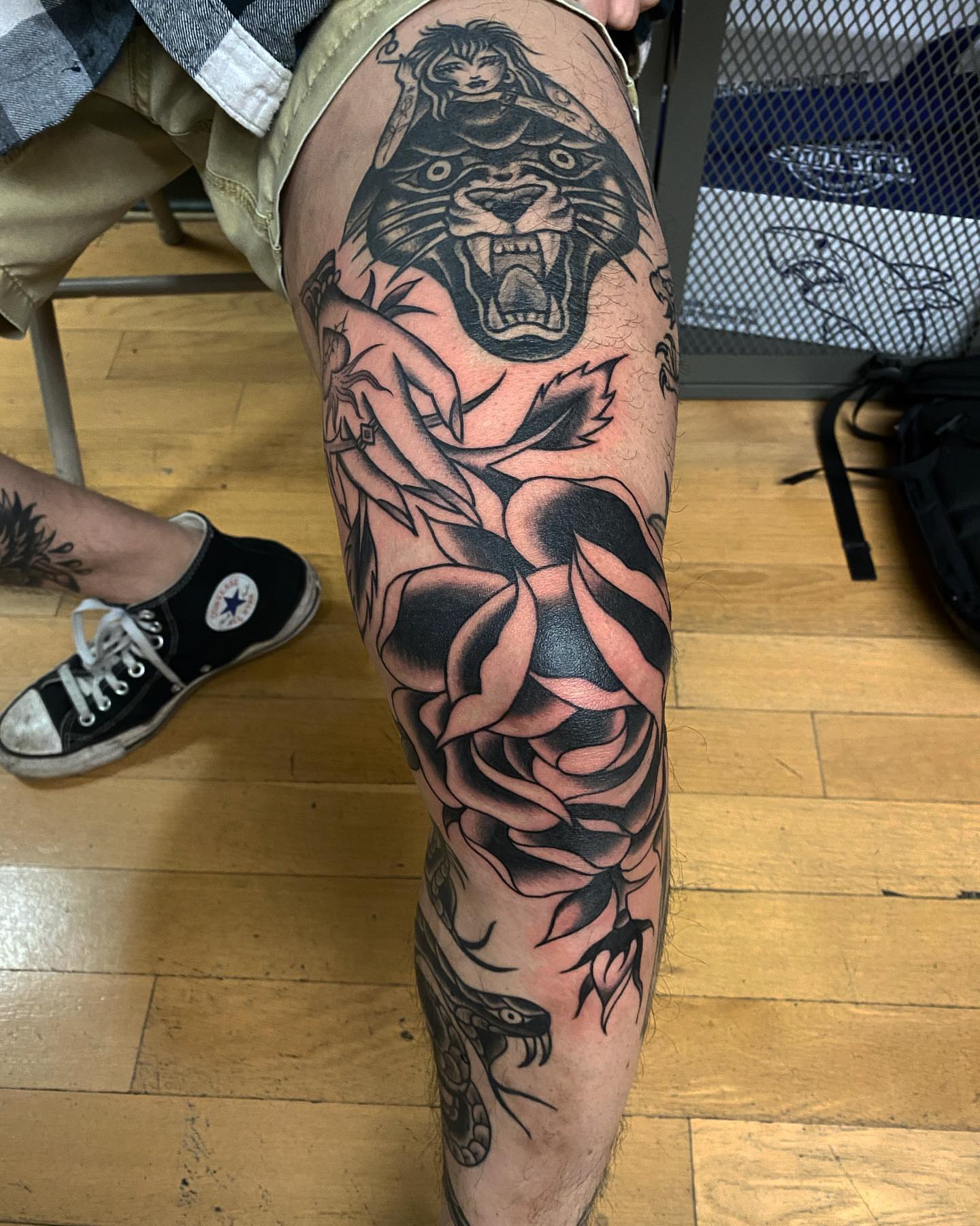 Panther and rose American traditional tattoo on the thigh by Alan Pham, San Jose, California