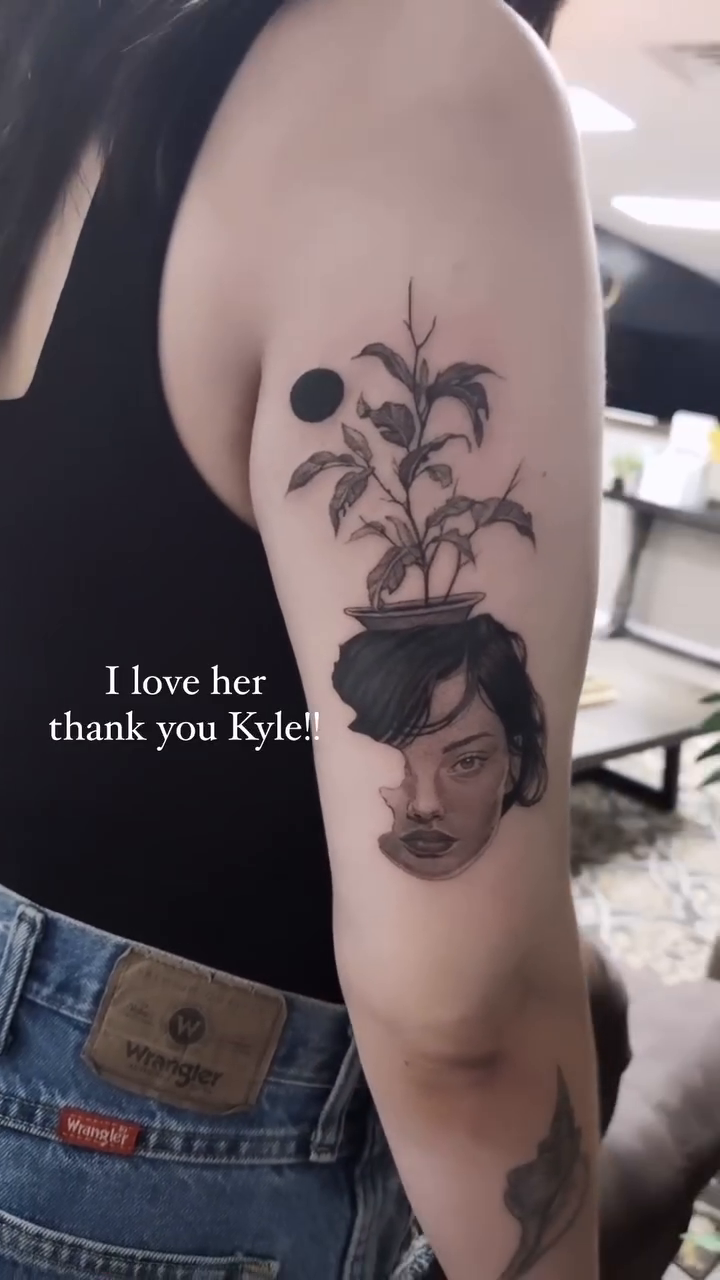 Woman's face with plant realism tattoo by Kyle Joseph [tattoo artist]
