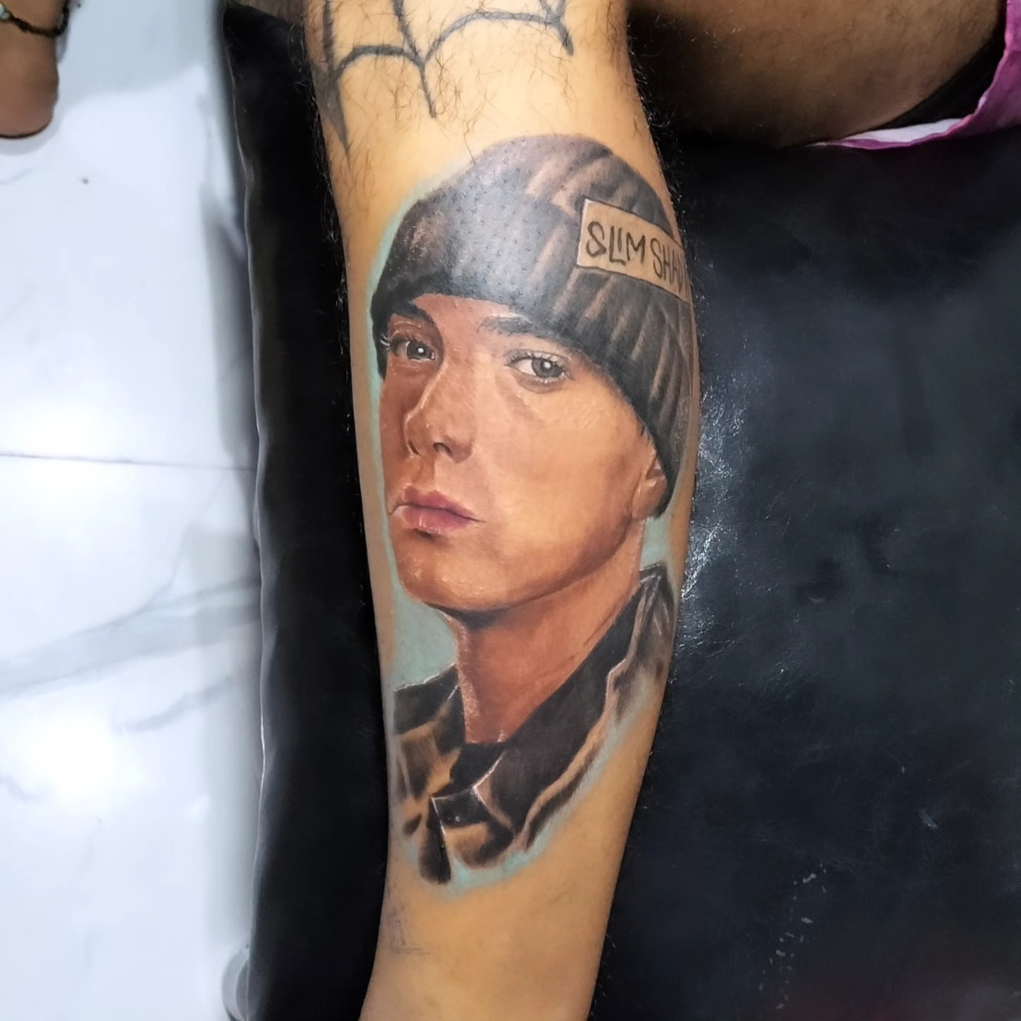 Eminem portrait realism tattoo on the forearm by Peter John