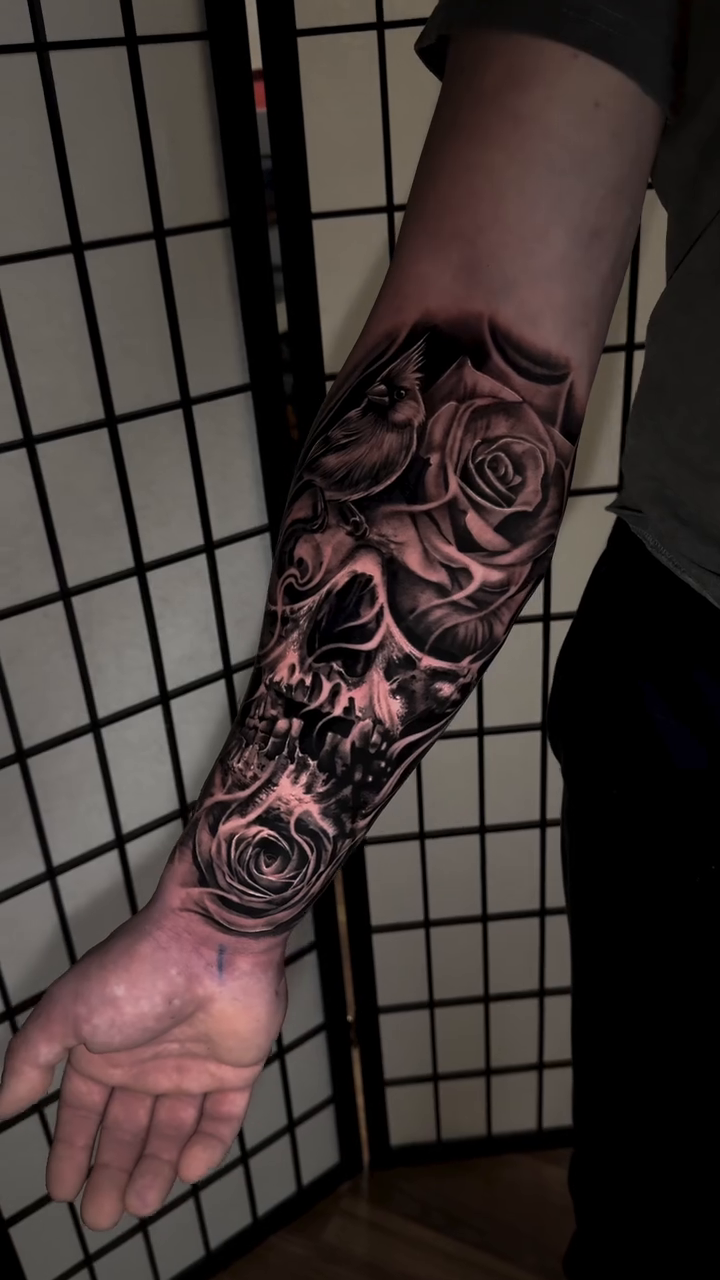 Skull and roses dark realism tattoo by Flamure Islami