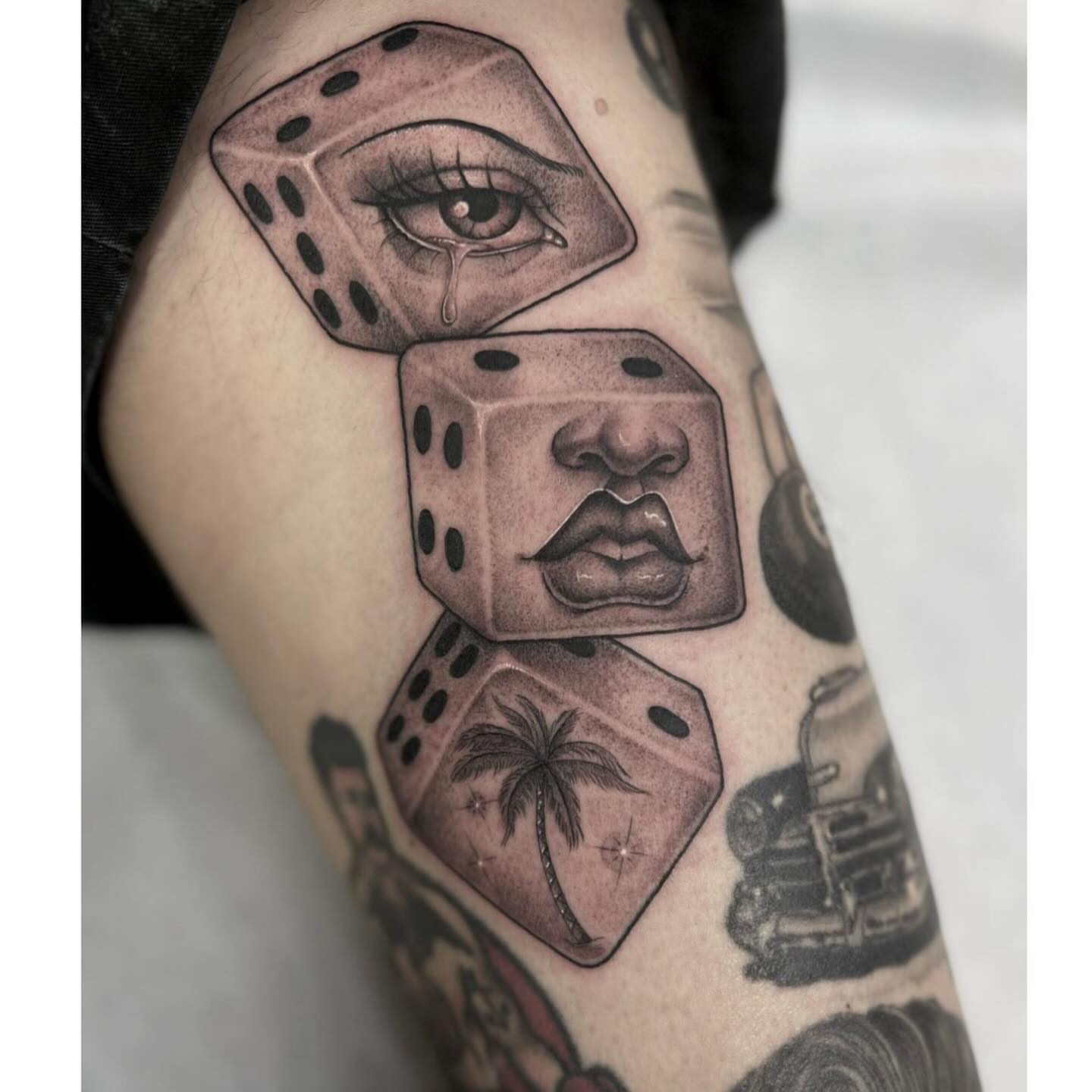 Dice with faces American traditional tattoo on the forearm by Valerie Dominguez