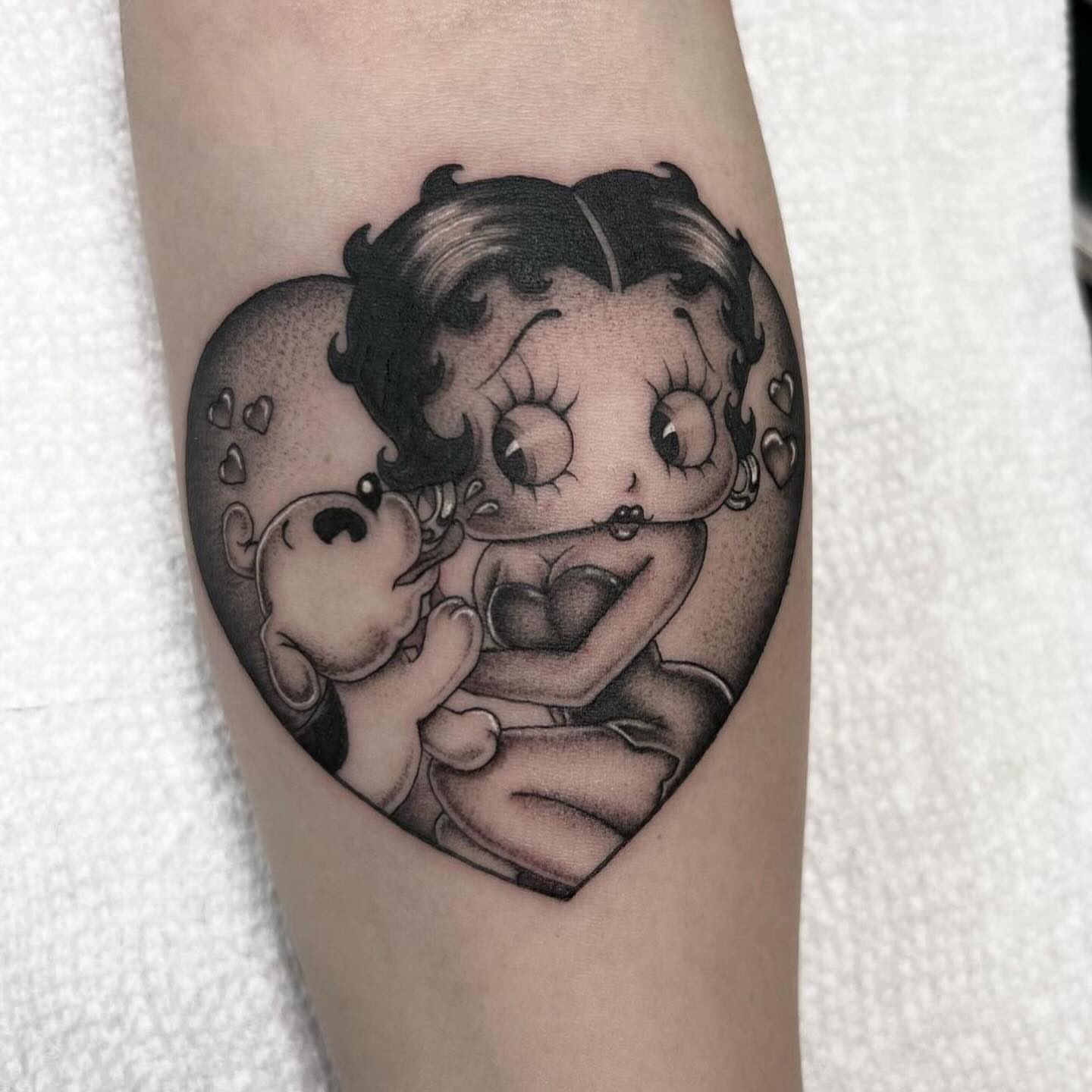 Betty Boop black and grey tattoo on the forearm by Valerie Dominguez
