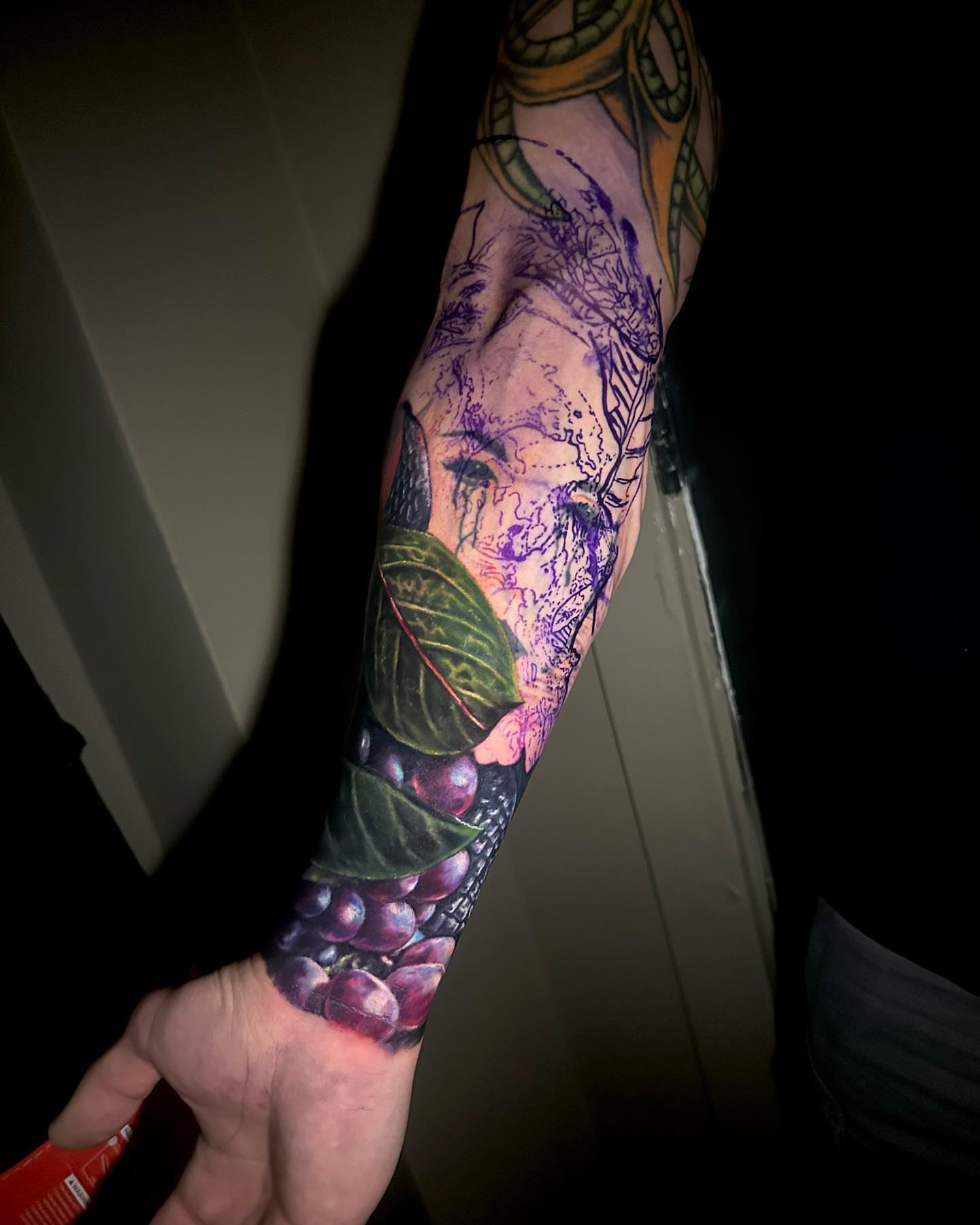 Berry cluster realism tattoo on the forearm by Amber Joy (AJ)