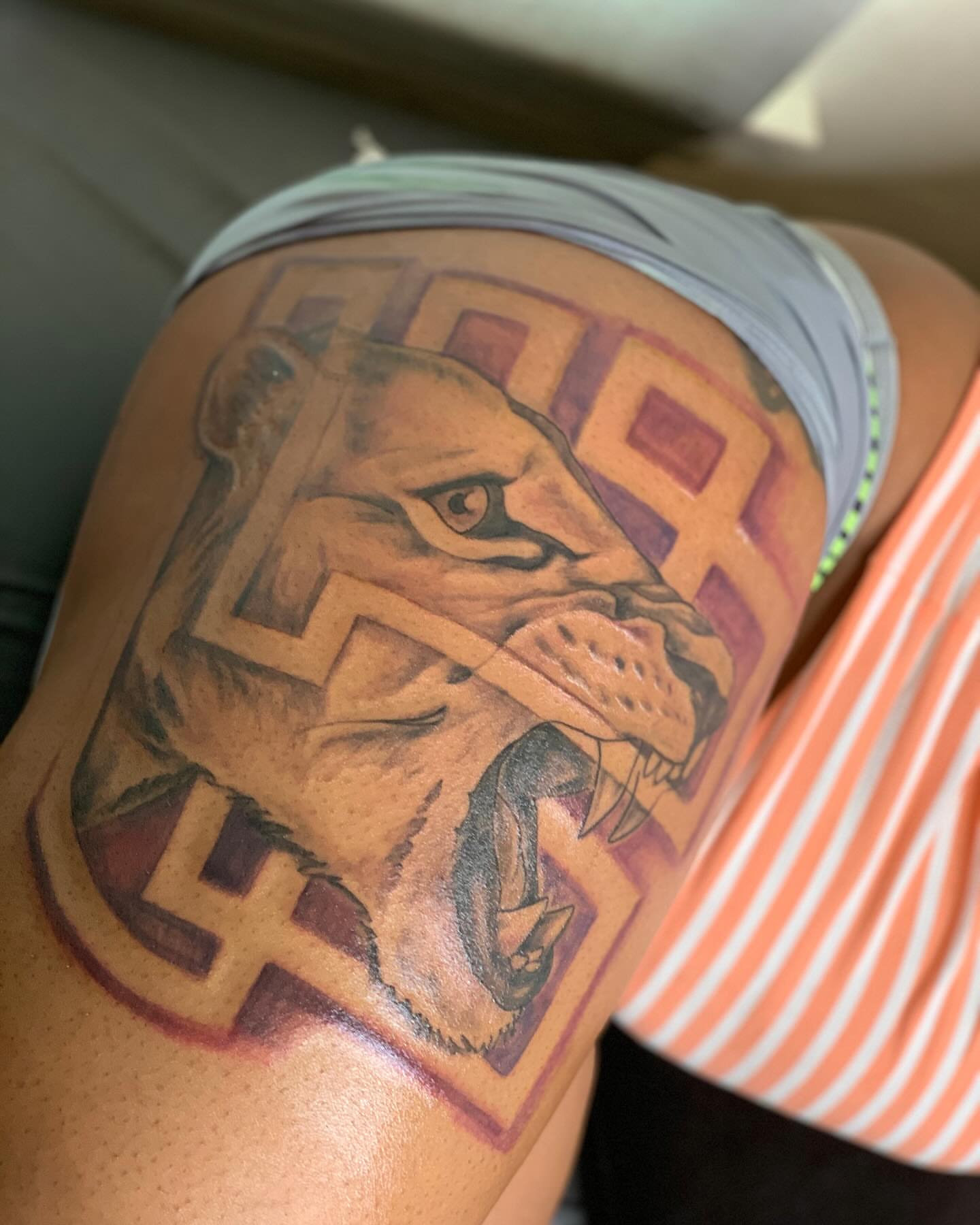 Lion realism tattoo on the thigh by Azaan (Zanye), Birmingham, Alabama