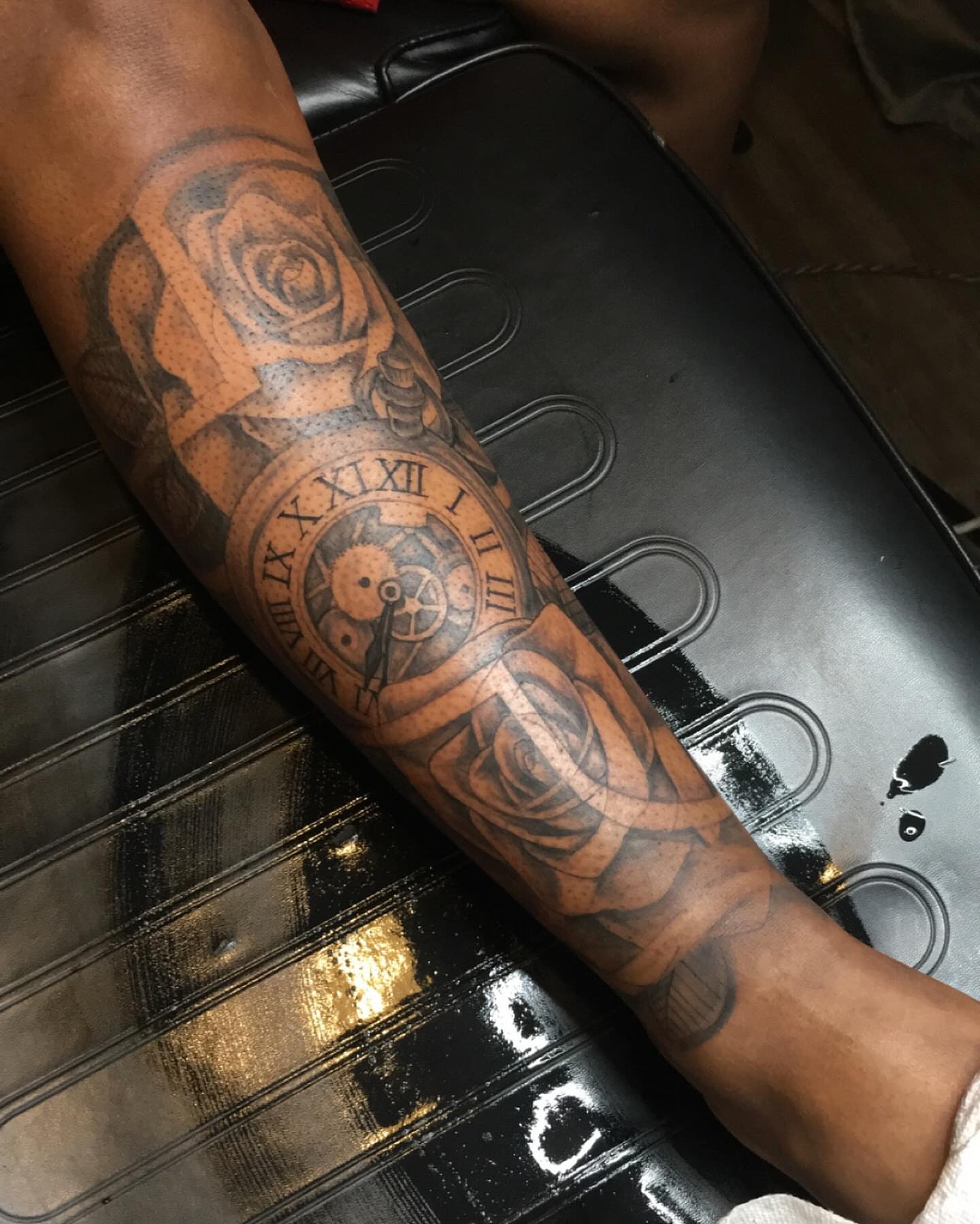 Clock and roses realism tattoo on the forearm by Azaan (Zanye), Birmingham, Alabama