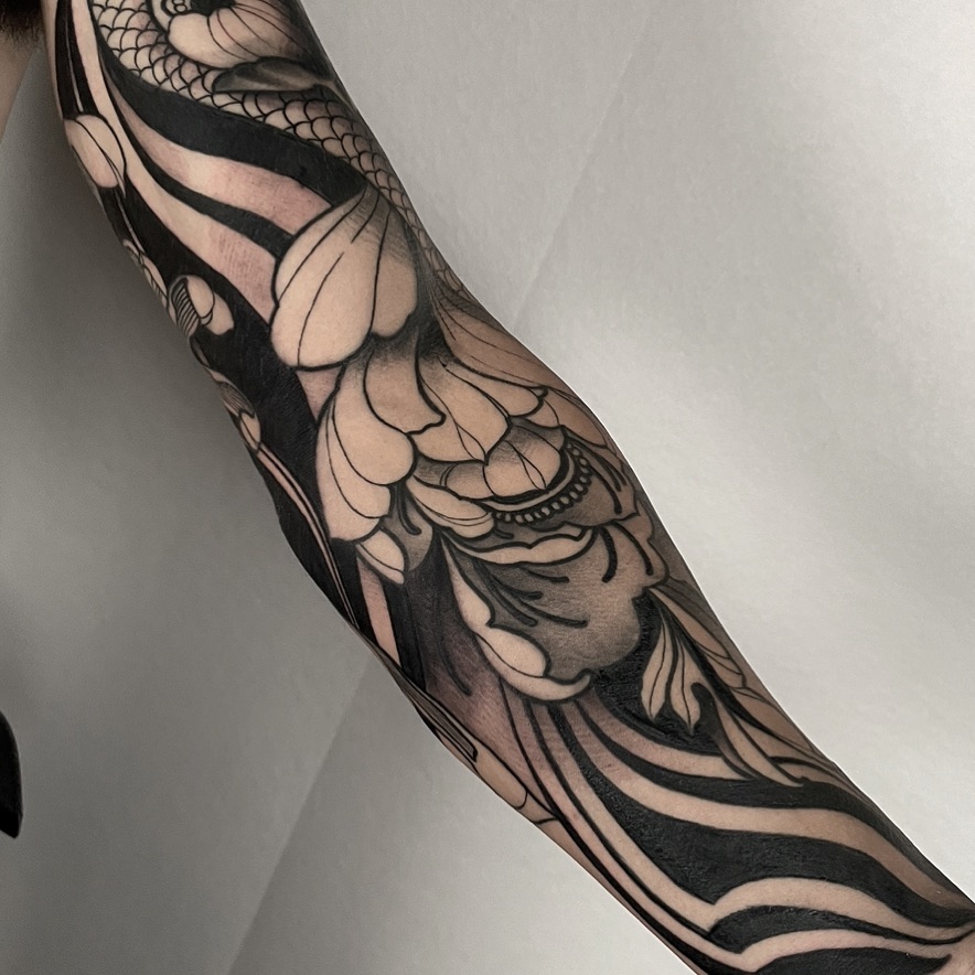 Fish and lotus black and grey tattoo on the forearm by ✖️mike Alan✖️