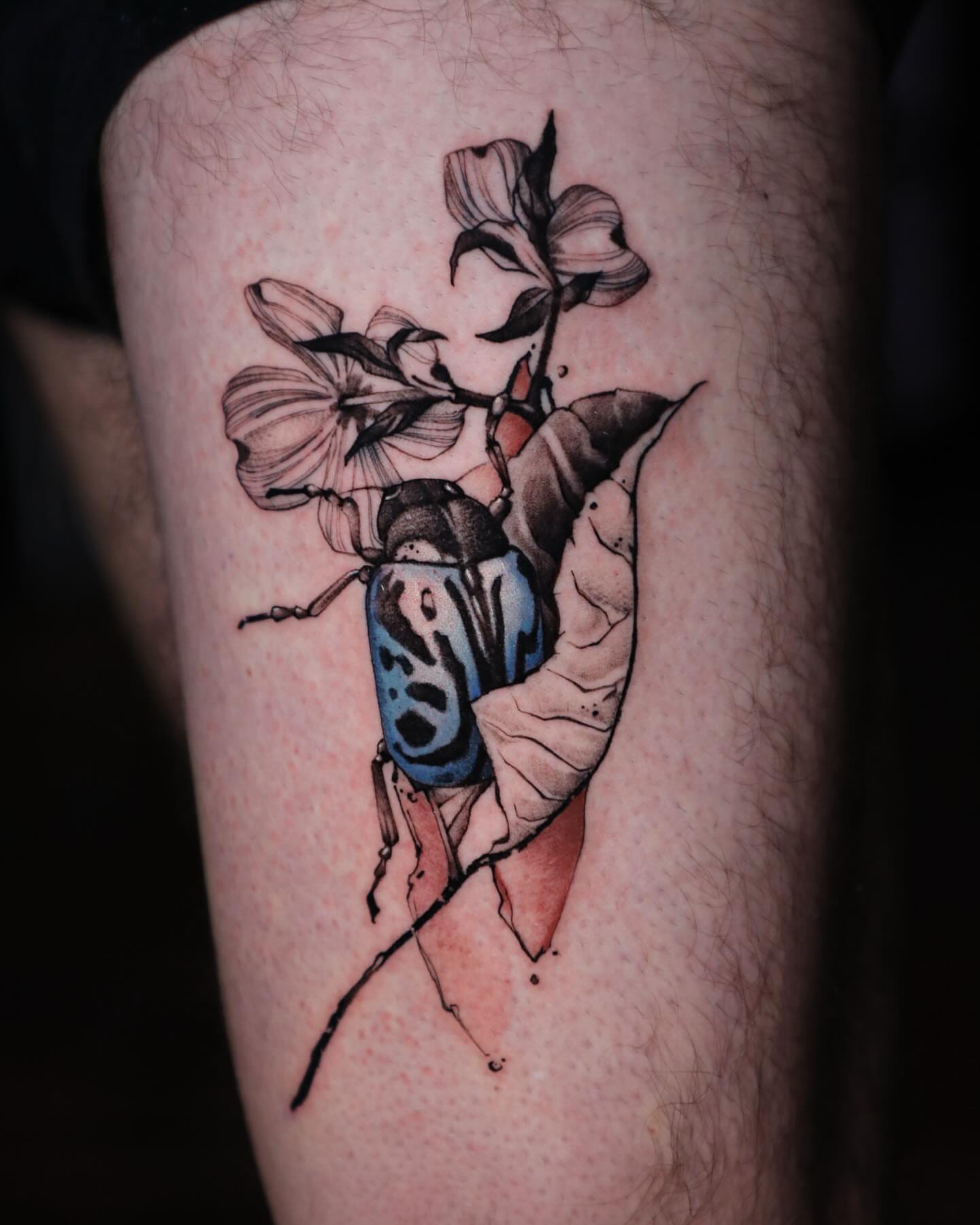Beetle and flowers realism tattoo on the forearm by Diego Romay