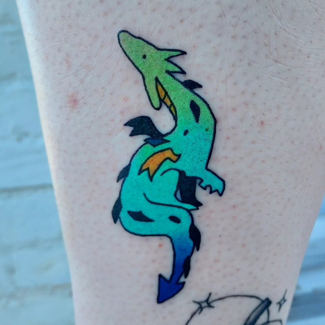 Dinosaur new school tattoo on the forearm by Spike Cameron