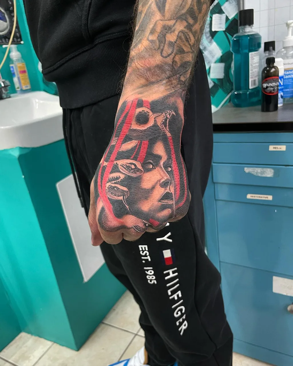 Man's face realism tattoo on the hand by lizzy, Damascus, Maryland