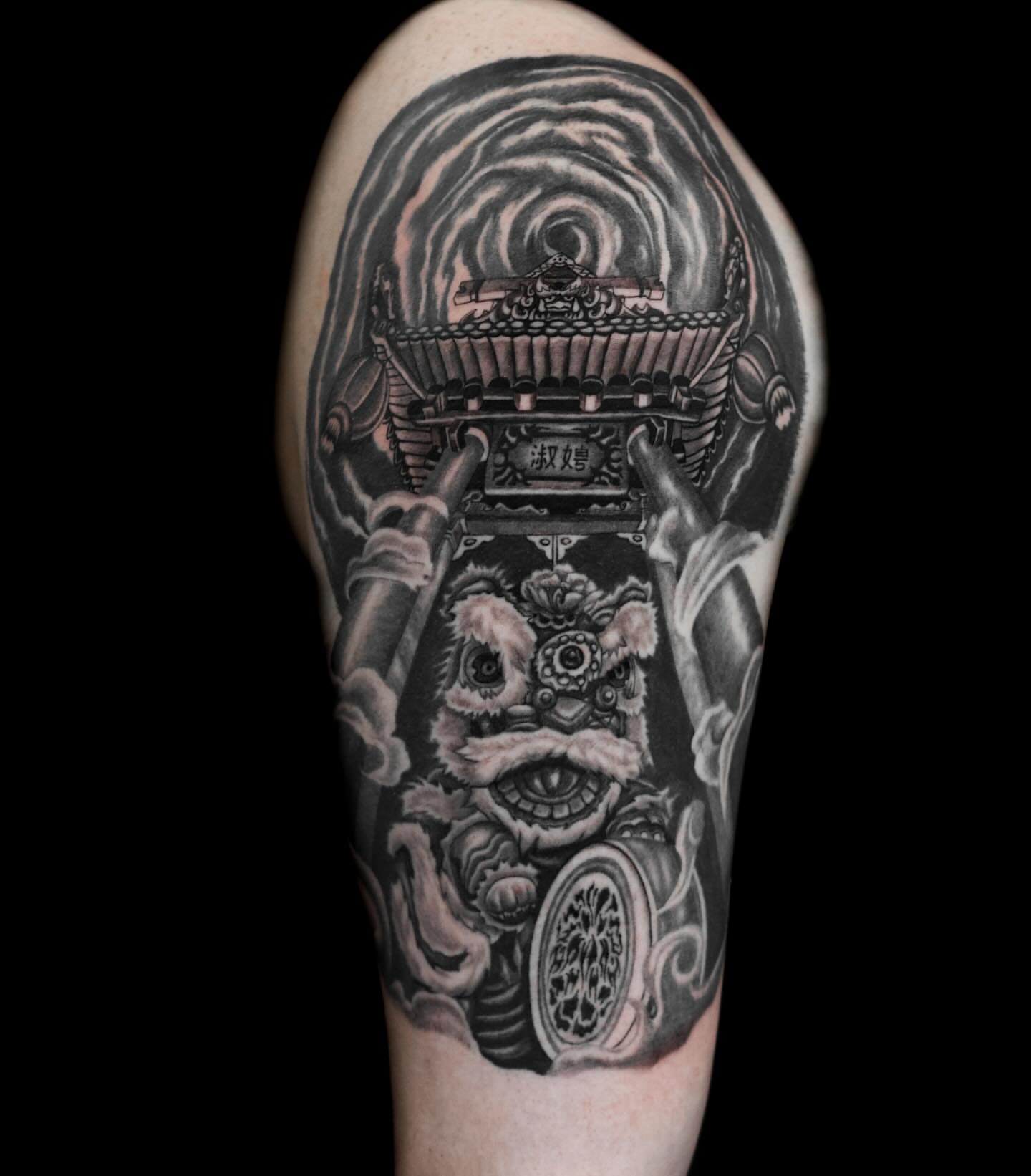 Lion statue realism tattoo on the forearm by Tattoo Artist