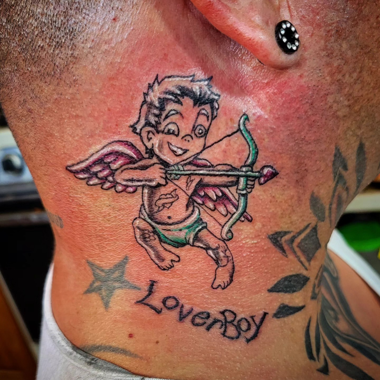 Cupid illustrative tattoo on the chest by Markus Hicks