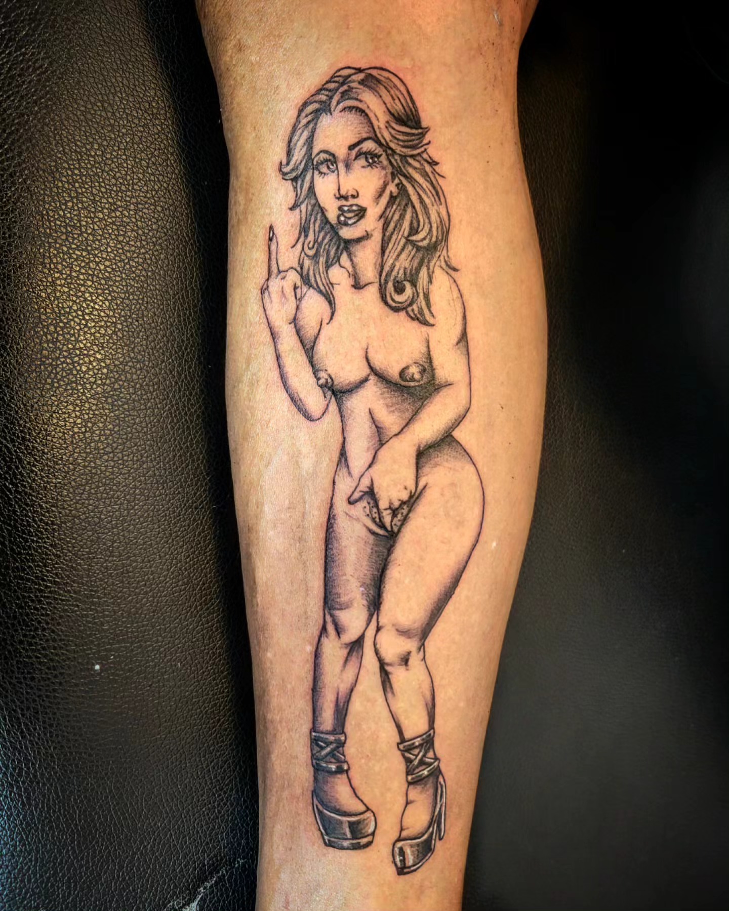 Nude woman black and grey tattoo on the forearm by Markus Hicks