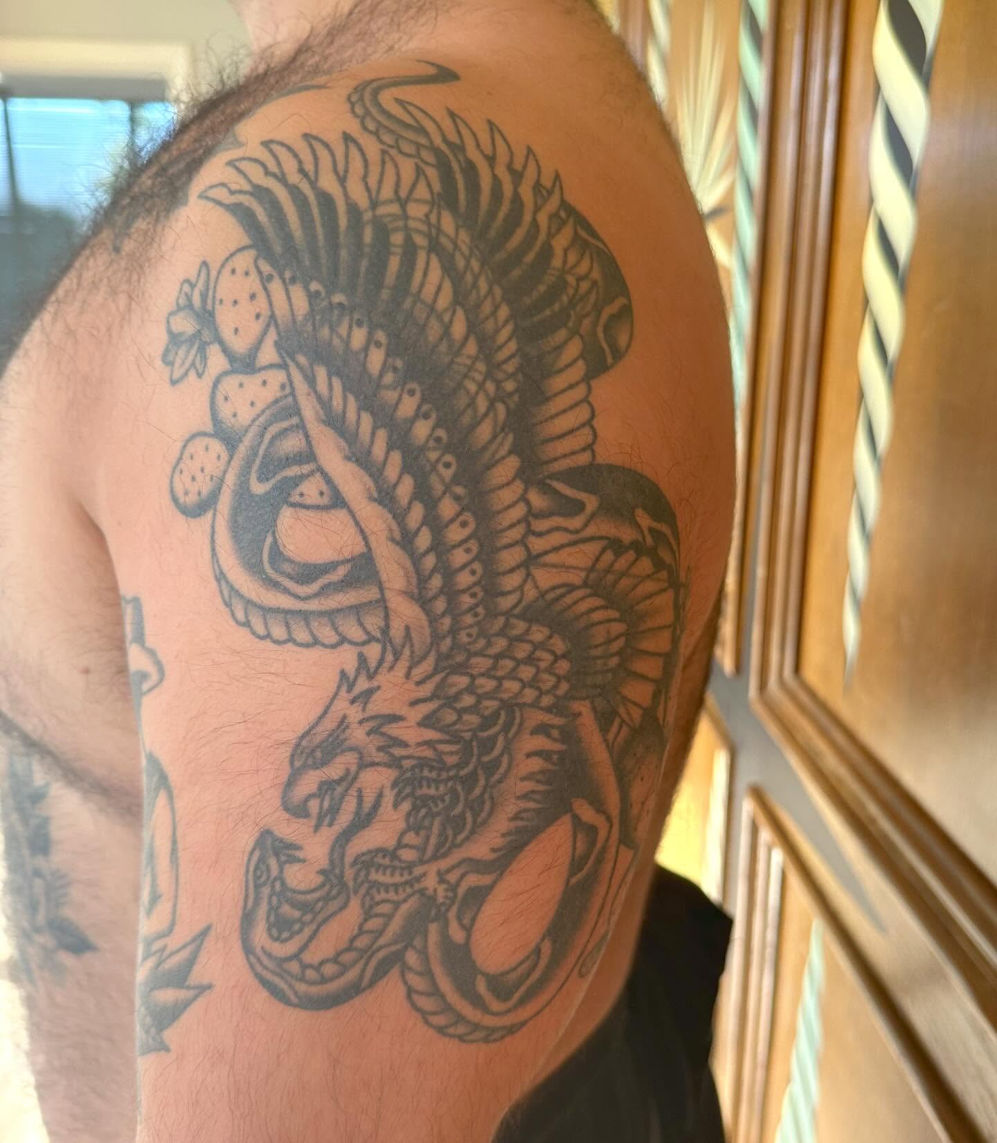 Dragon black and grey tattoo on the shoulder by Jess Ritchie, Austin, Texas