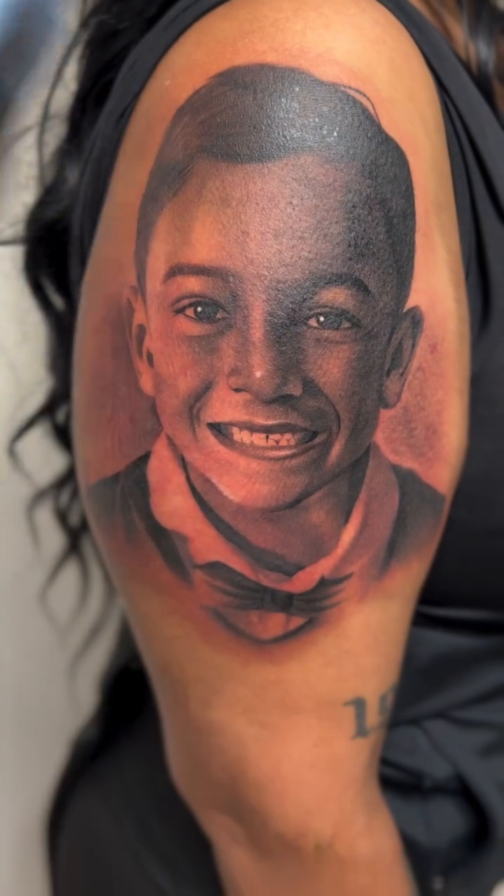 Portrait of a young boy realism tattoo by Jason Martinez
