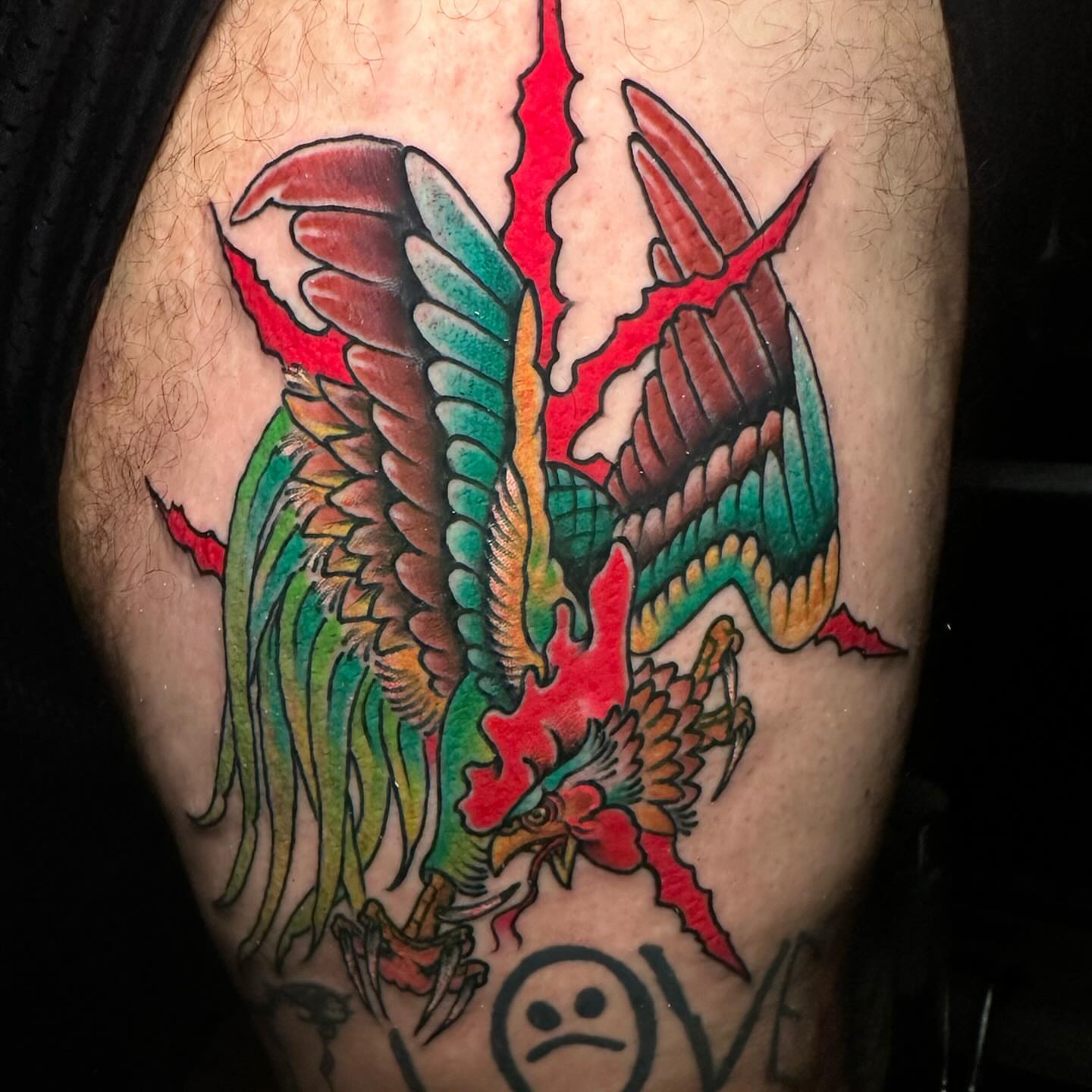 Phoenix American traditional tattoo on the thigh by Edward Choat