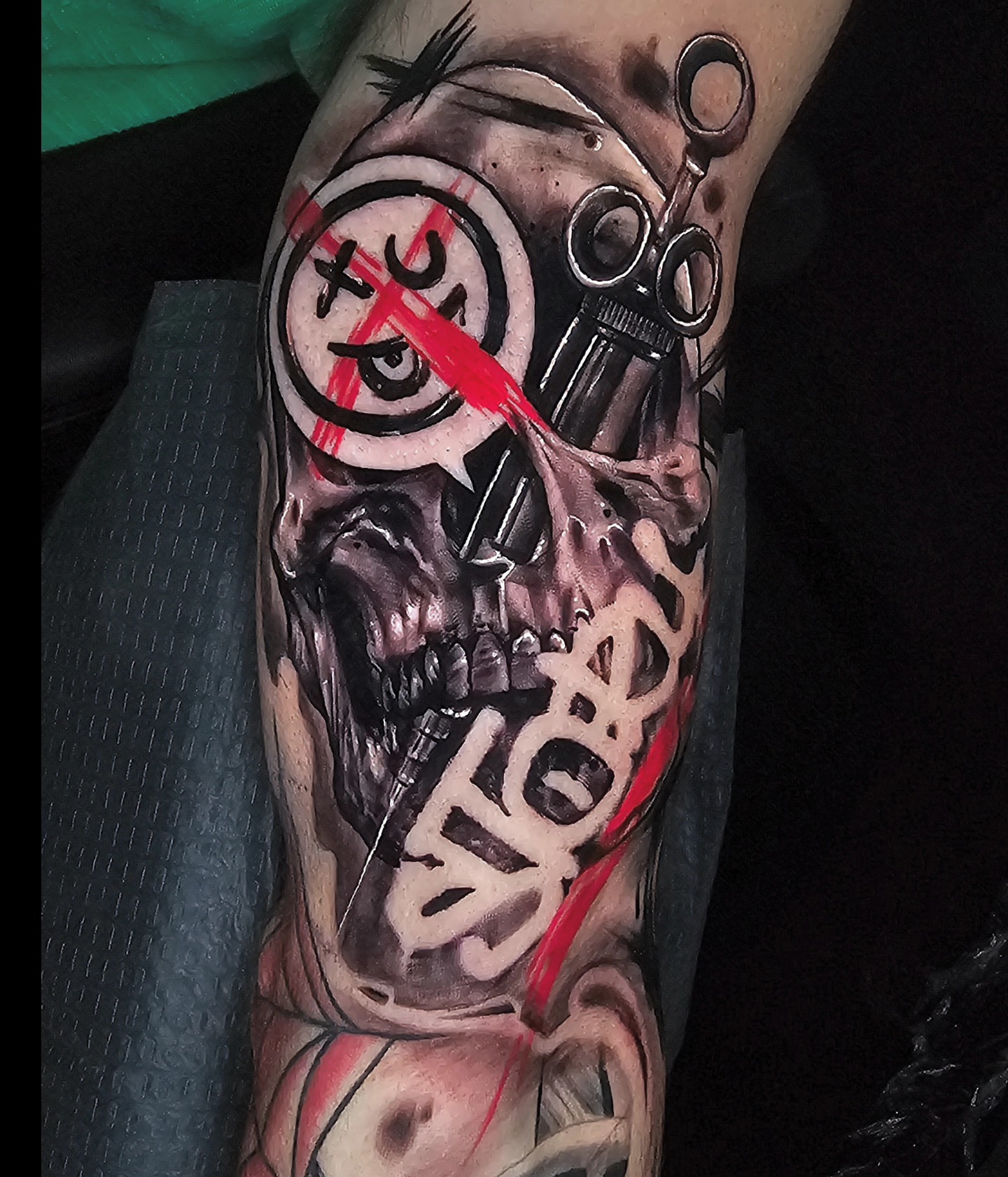 Skull with scissors dark realism tattoo on the forearm by Christian Mulvey