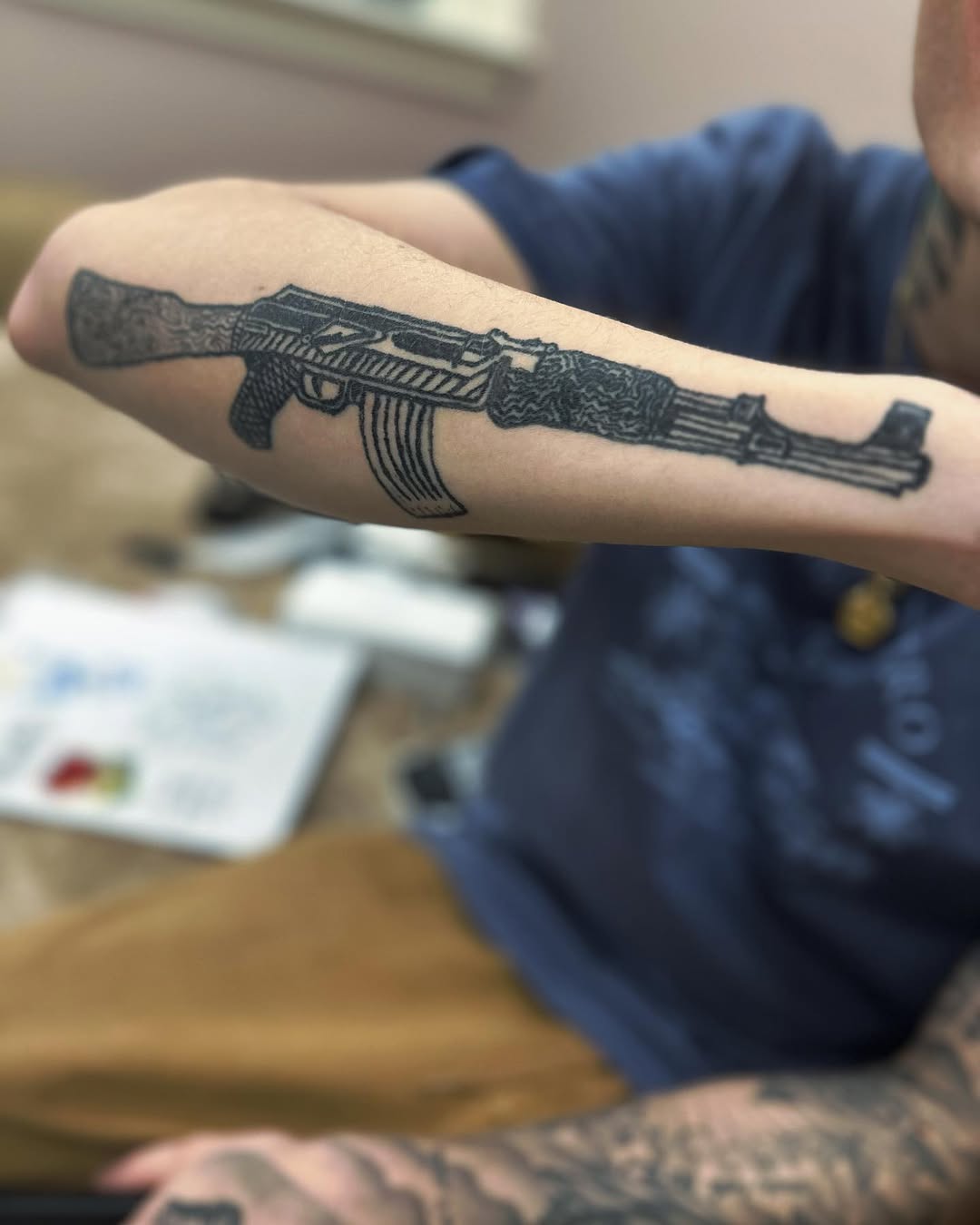 AK-47 rifle tattoo on the forearm by Silky Inks NJ 201, North Haledon, New Jersey