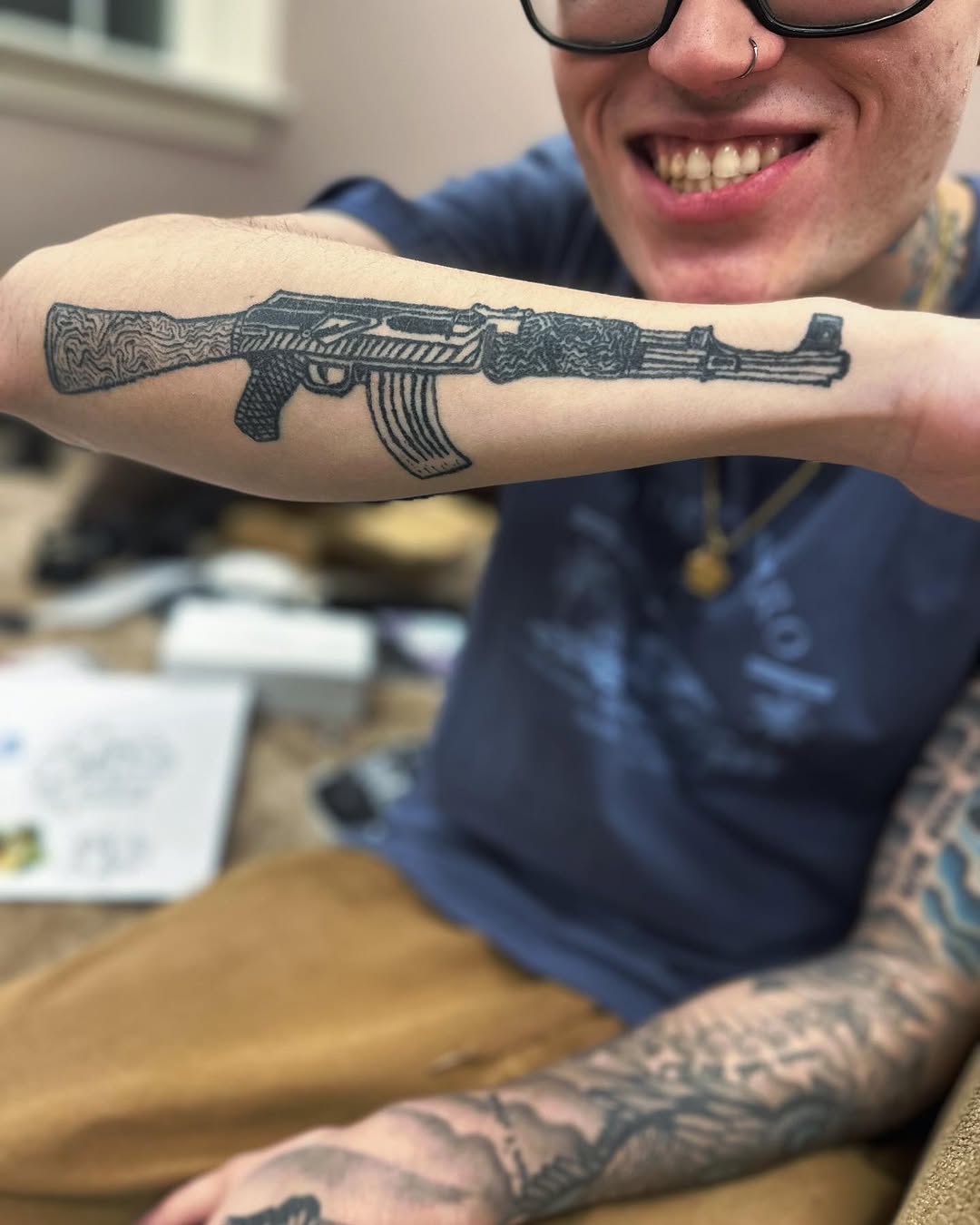 AK-47 rifle minimalist tattoo on the forearm by Silky Inks NJ 201, North Haledon, New Jersey