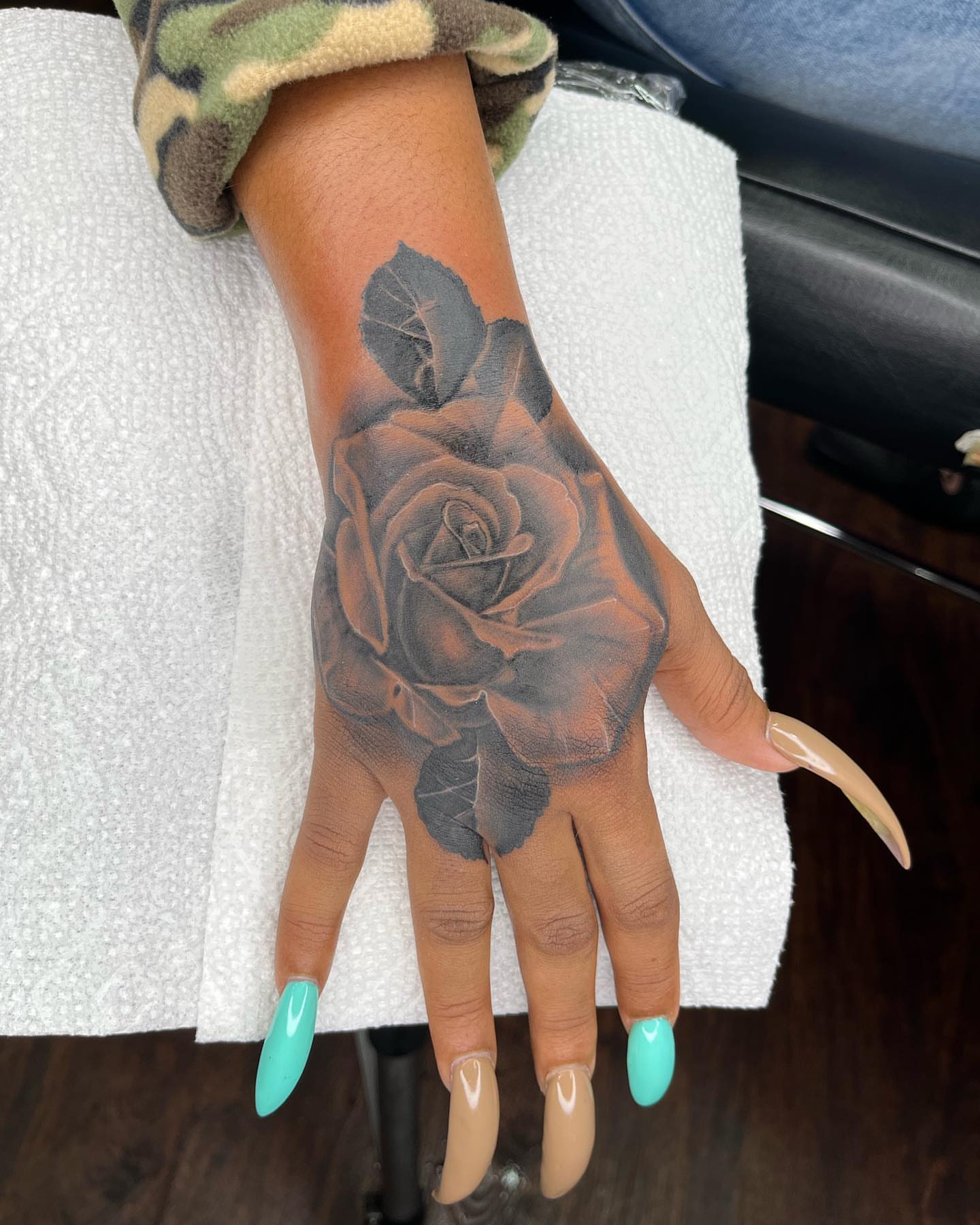 Rose realism tattoo on the hand by Darius Armour (Tattoo Artist)