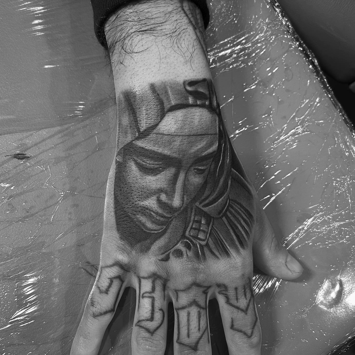Man with mask realism tattoo on the hand by Alex Cruz 707