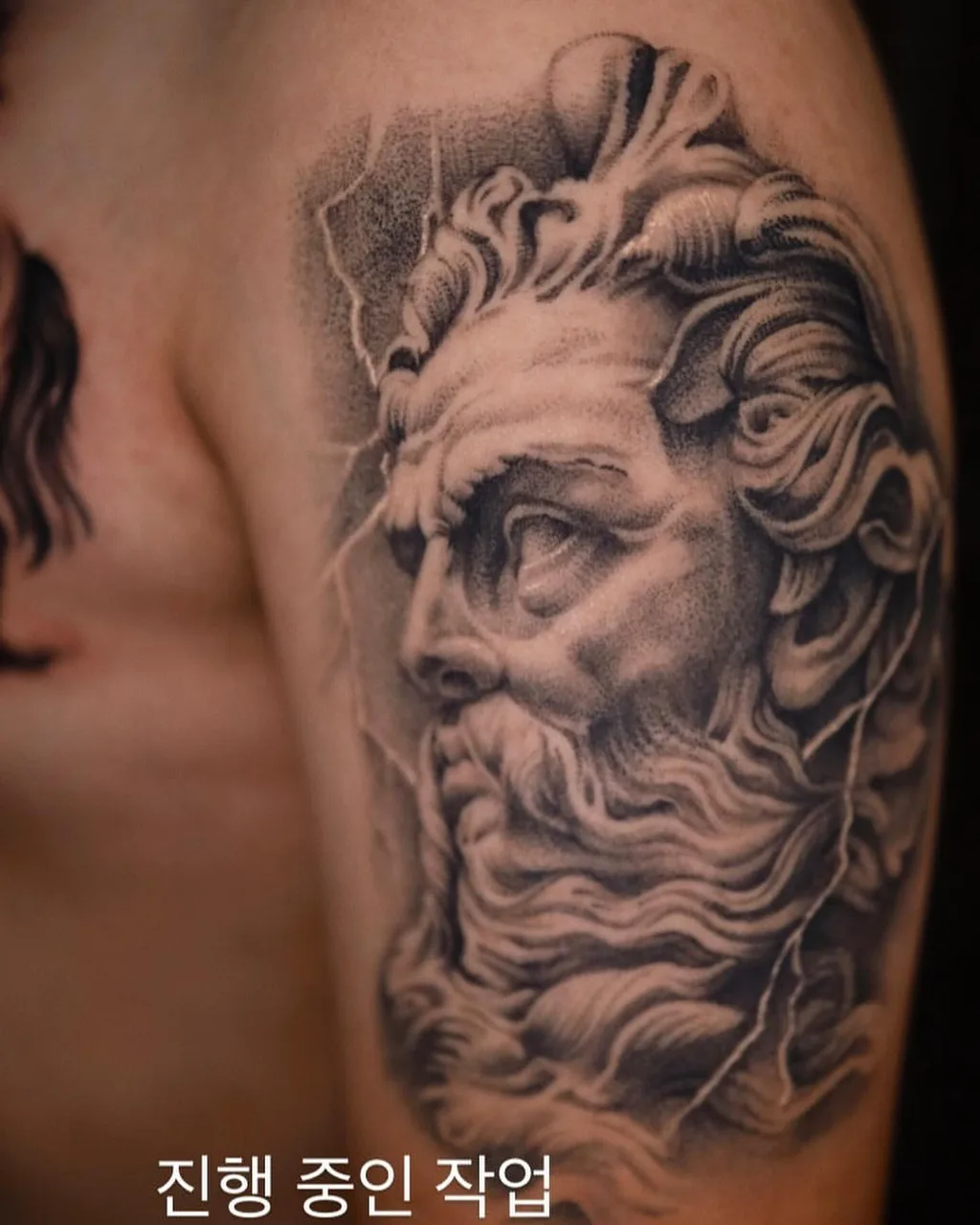 Bearded man's head realism tattoo on the forearm by Minho