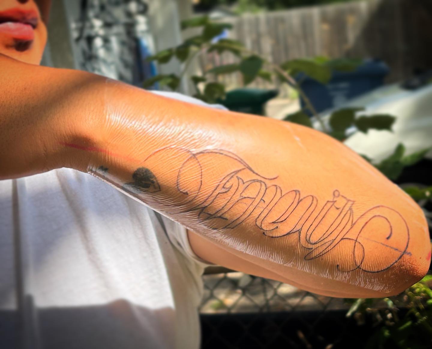 Script lettering lettering script tattoo on the forearm by Bear