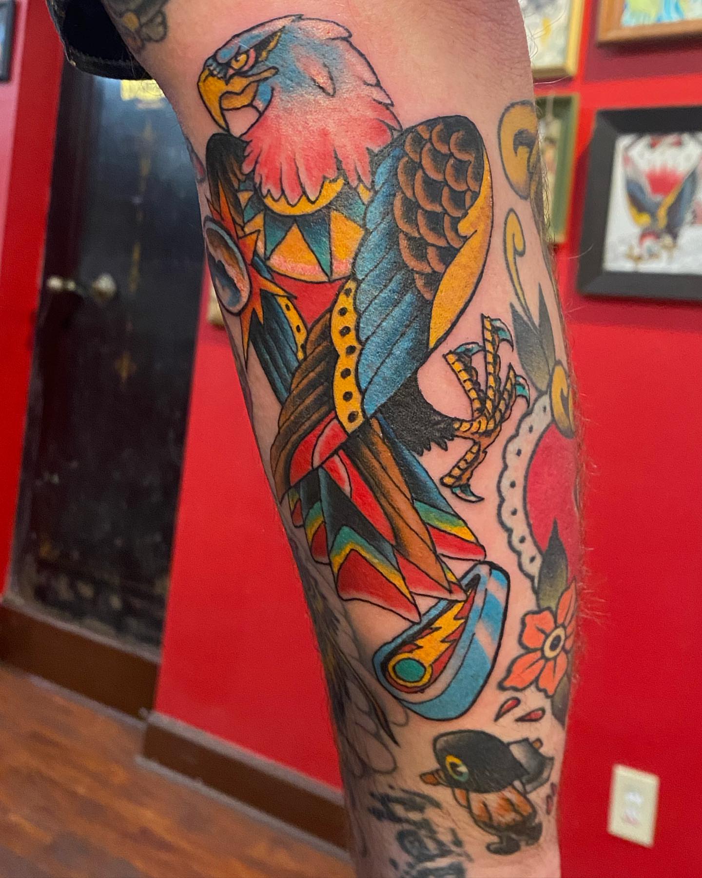 Parrot American traditional tattoo on the forearm by Christopher Sanders