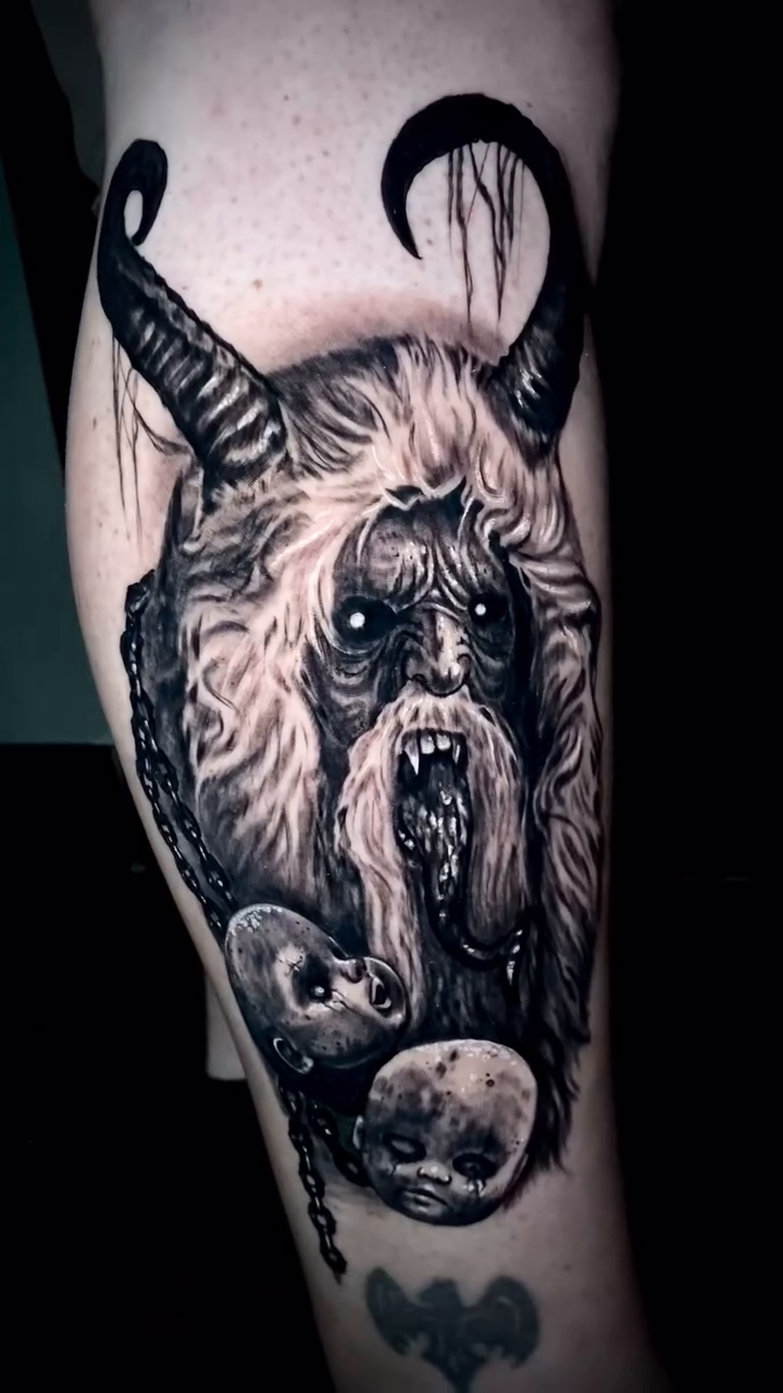 Krampus with skulls dark realism tattoo by Caitlyn Campbell