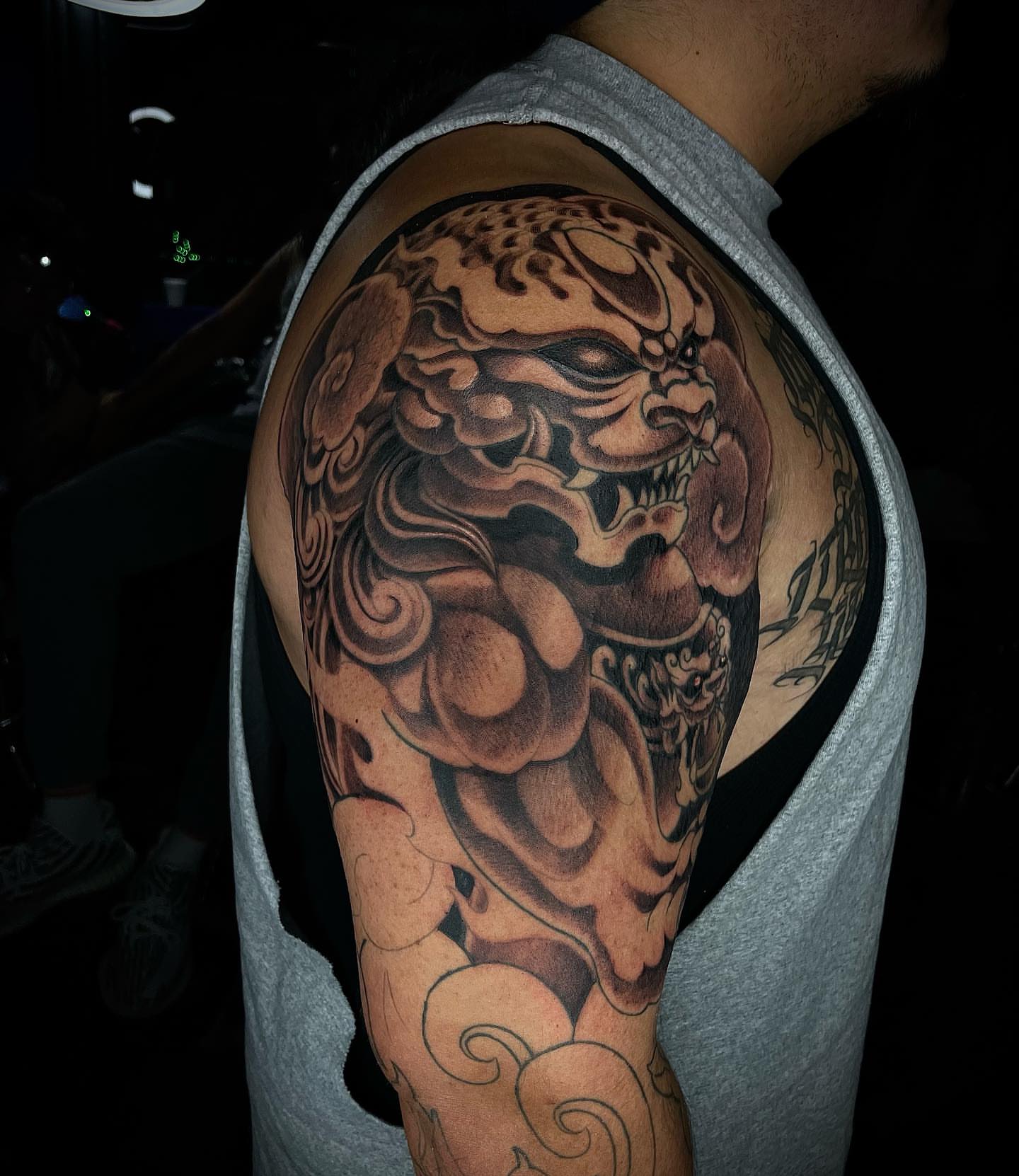 Lion japanese irezumi tattoo on the shoulder by Tam Nguyen