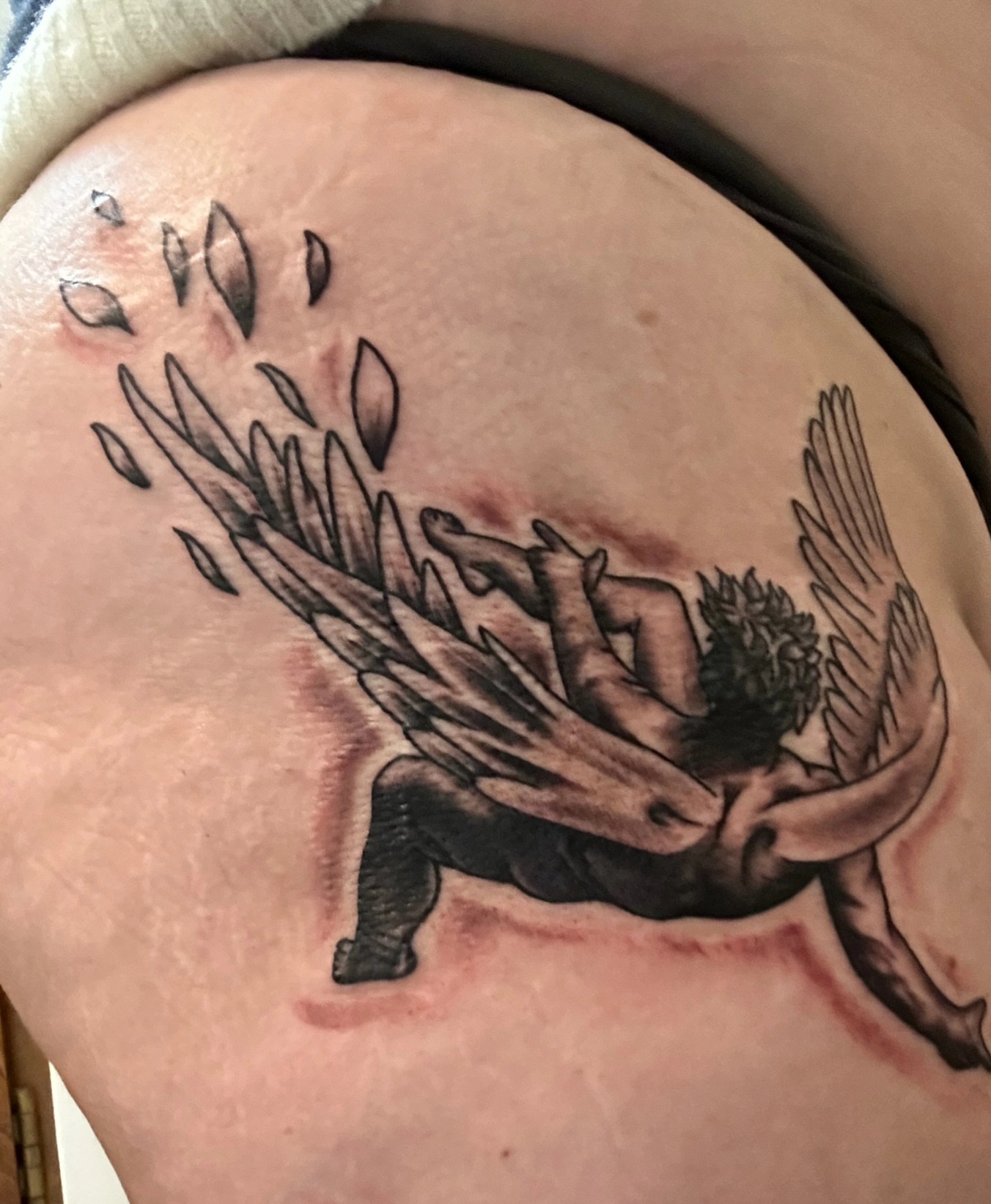 Angel with wings neo-traditional tattoo on the shoulder by @thedevilspaintbrush_
