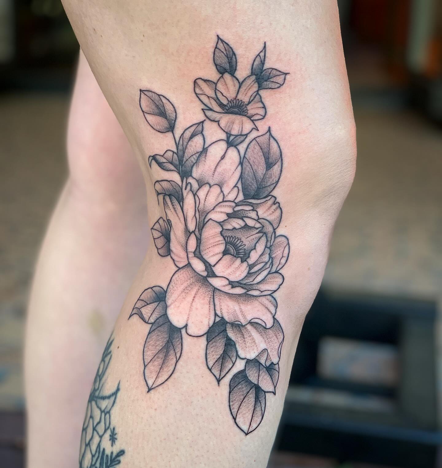 Peony bouquet black and grey tattoo on the forearm by Brad Sterling