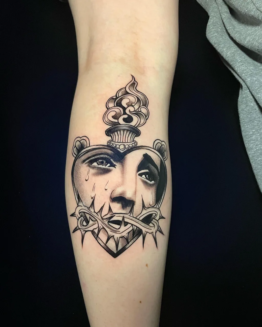 Heart with face realism tattoo on the forearm by lizzy, Damascus, Maryland