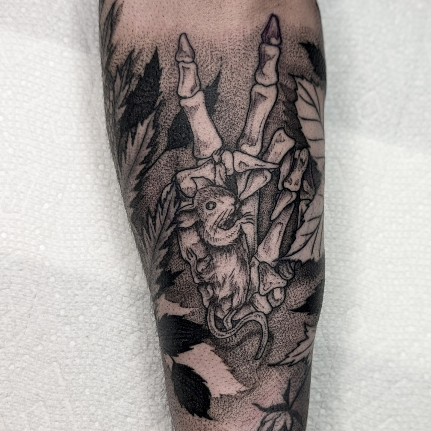 Rabbit and bones dotwork tattoo on the forearm by Gail Howard Perry III