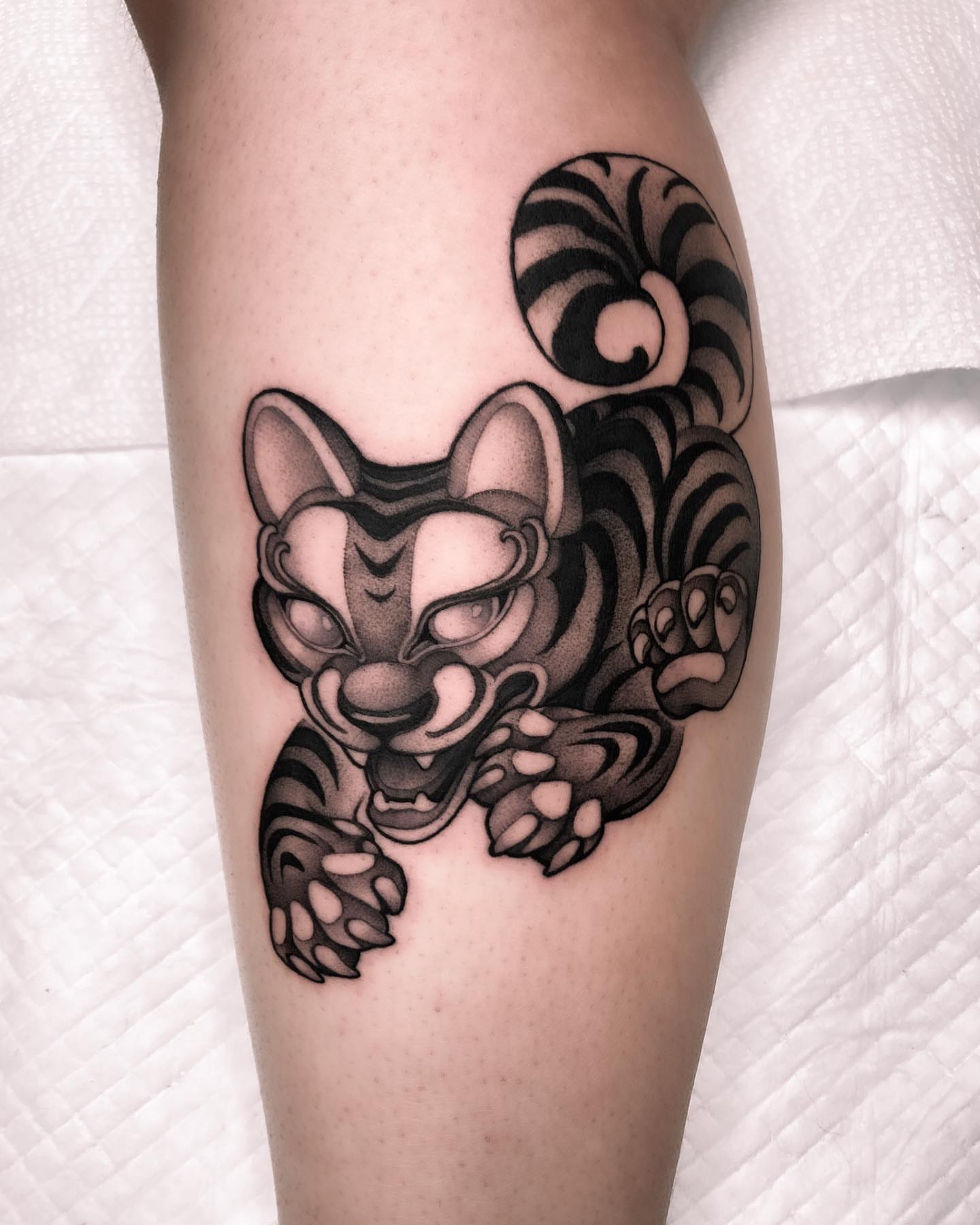 Cat black and grey tattoo on the forearm by Tattoo artist in Charlotte,NC