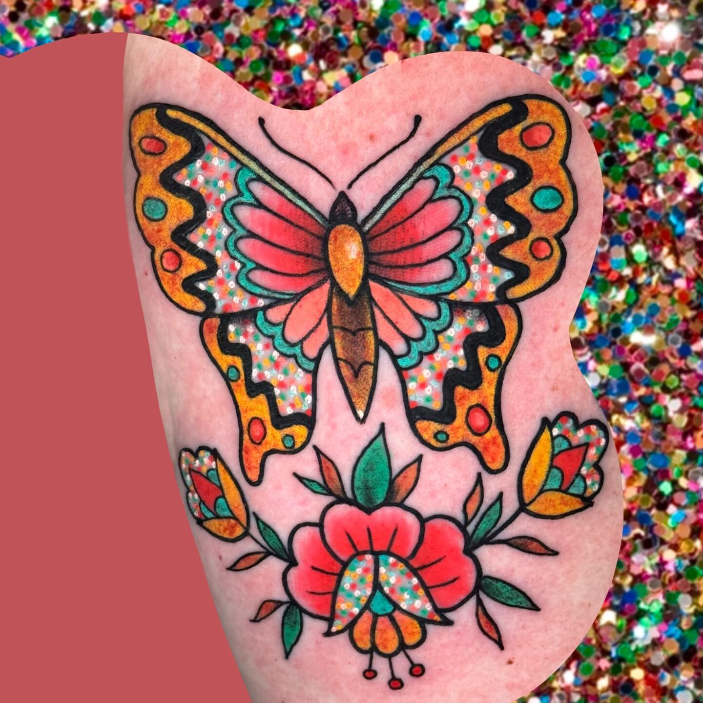 Butterfly and floral bouquet American traditional tattoo on the thigh by Chelsea Lane