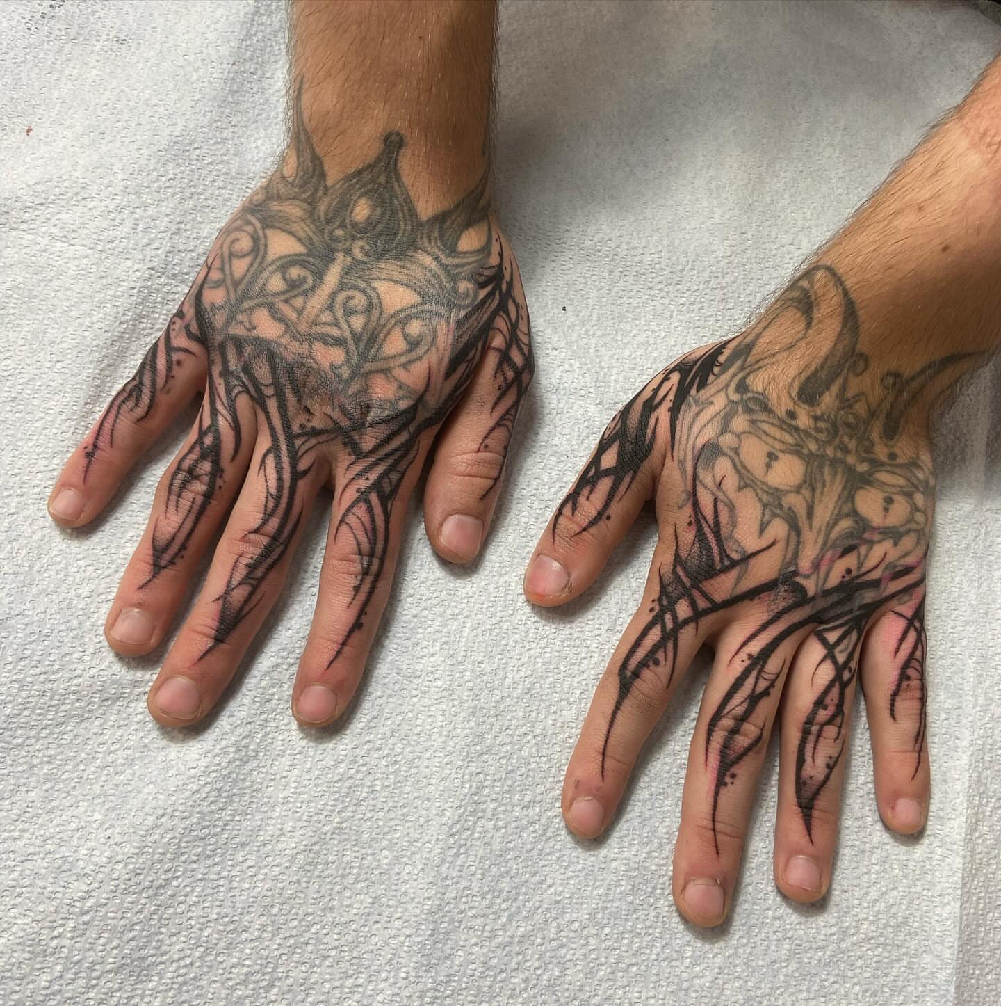 Abstract design black and grey tattoo on the hand by Nathan