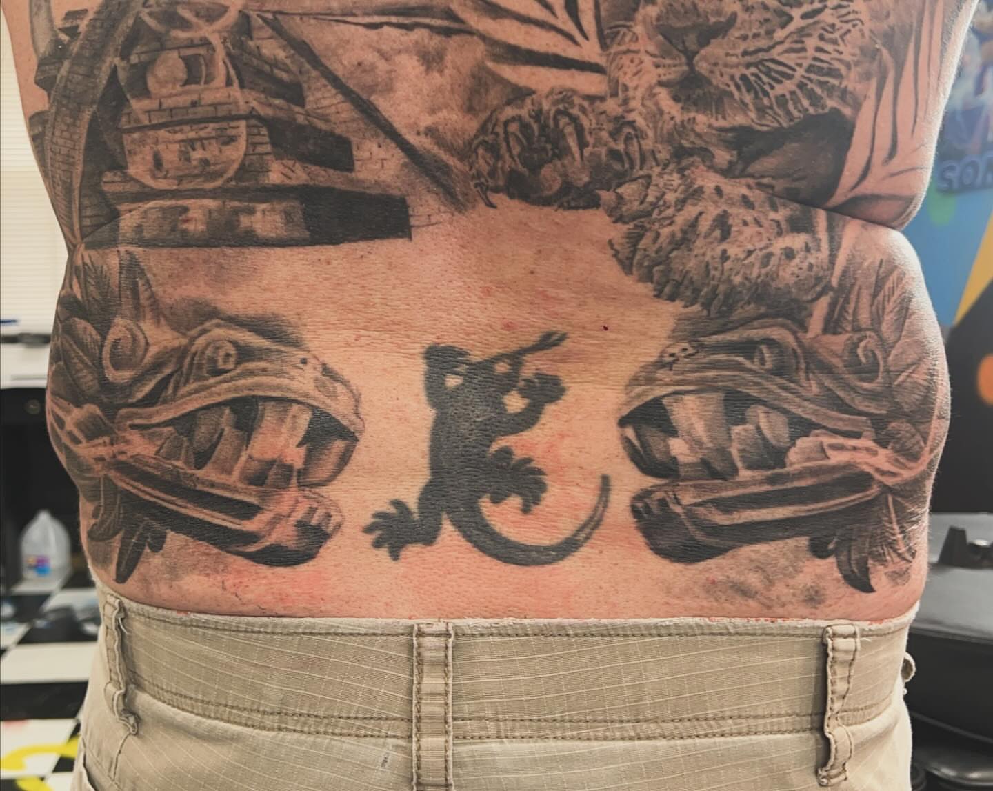 Gecko and lizards black and grey tattoo on the torso by Dre Ortiz